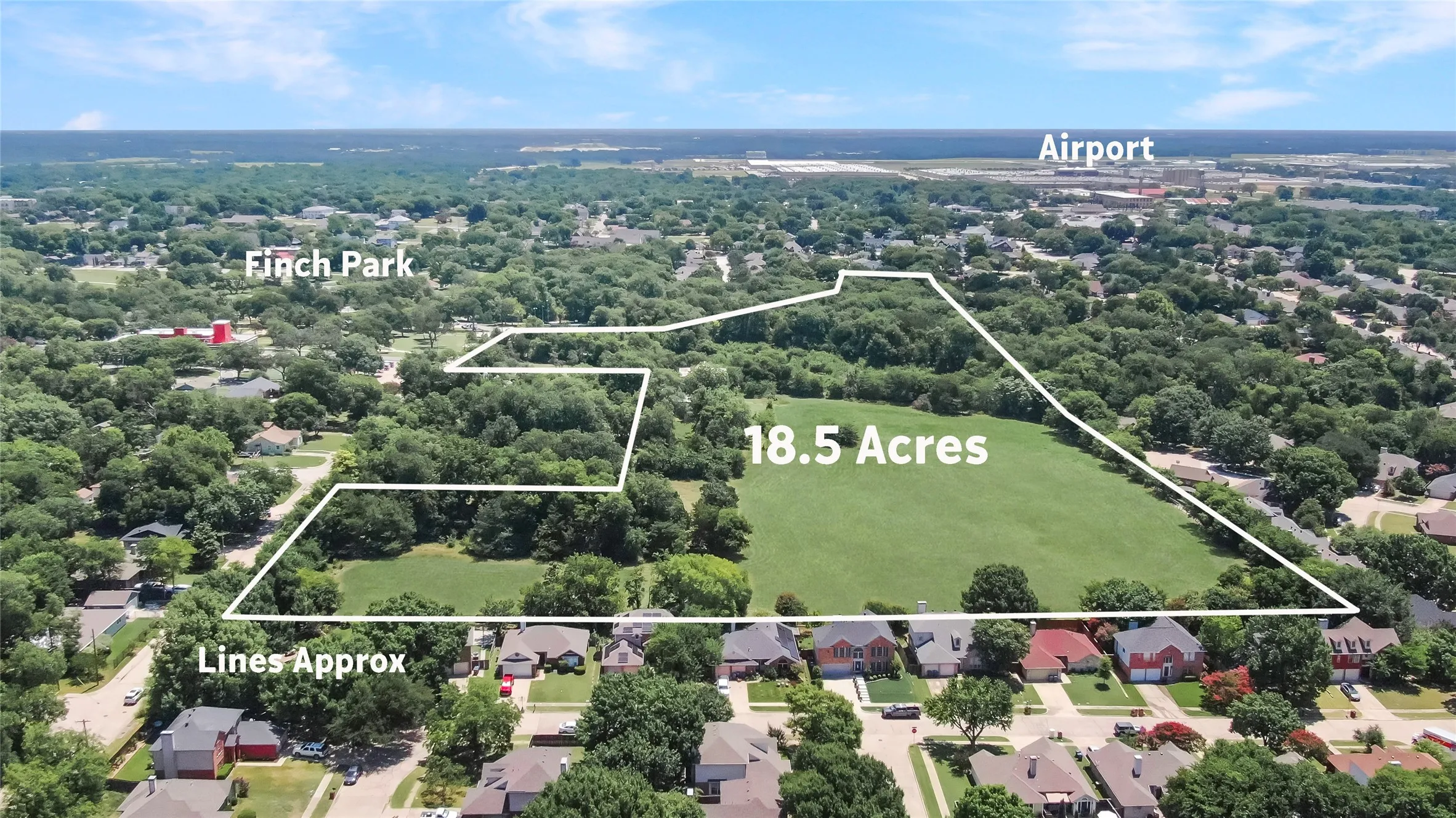 18.5-acre property featuring both open green spaces and dense tree coverage