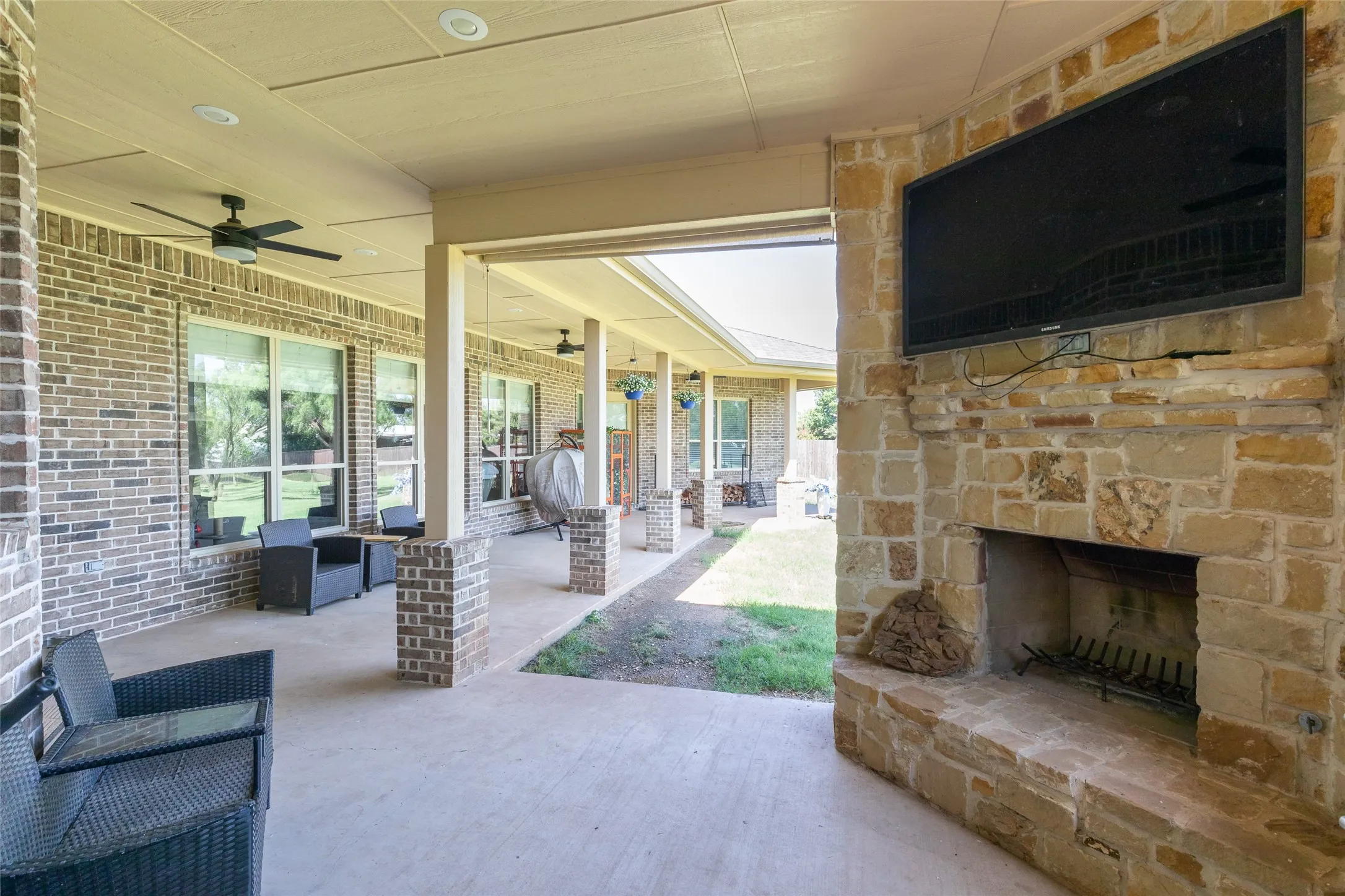 Back patio with fireplace and outdoor kitchen
