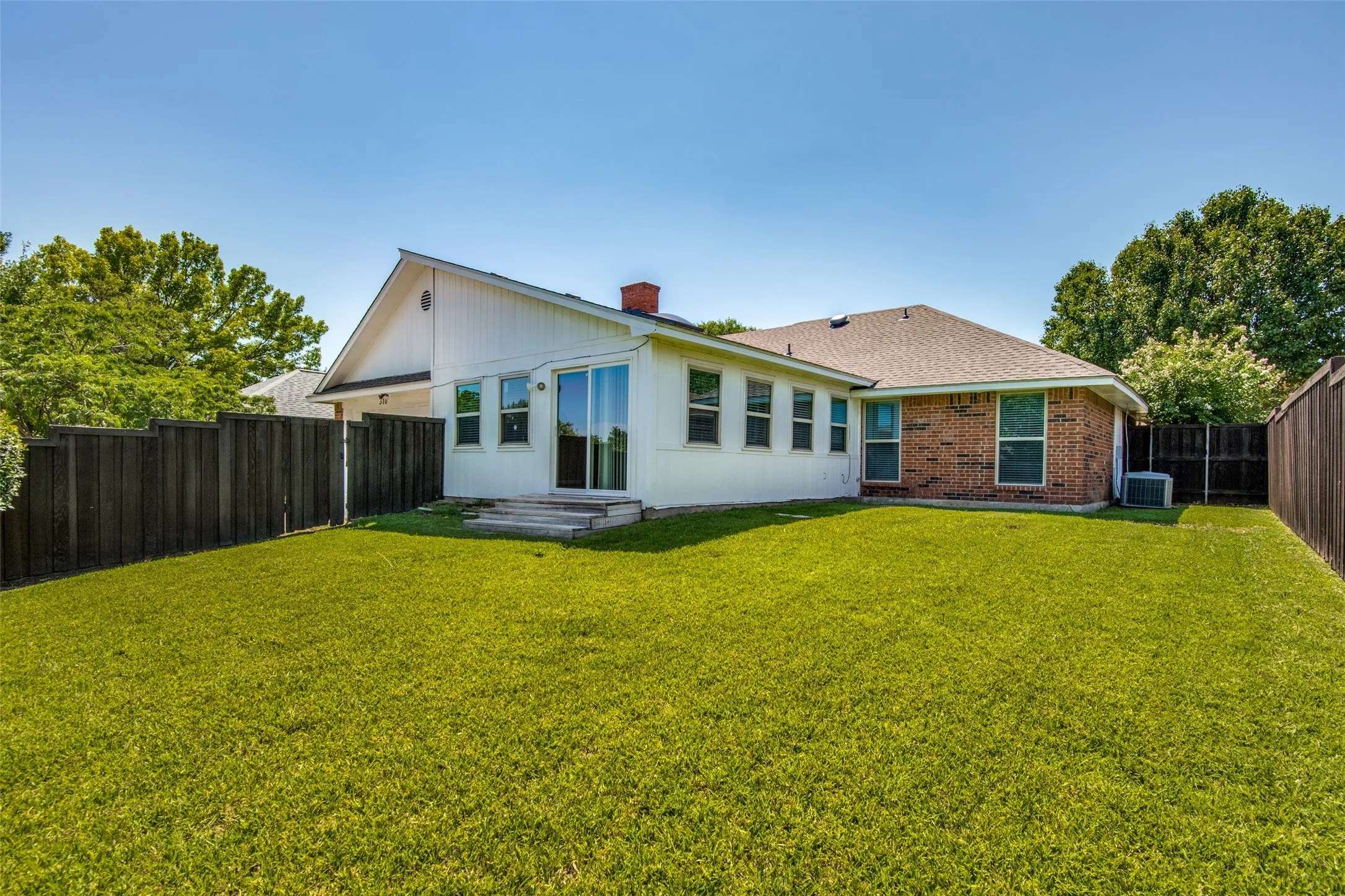 Expansive green lawn providing a substantial outdoor area