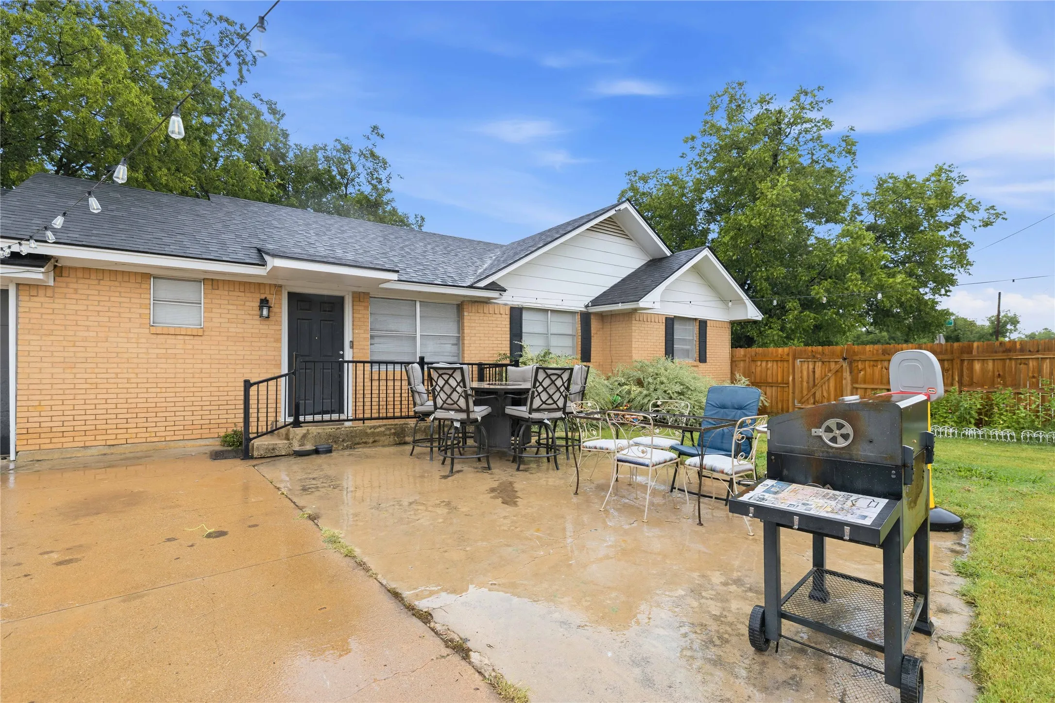 Driveway and privacy fenced area. View is from Idlewild St
