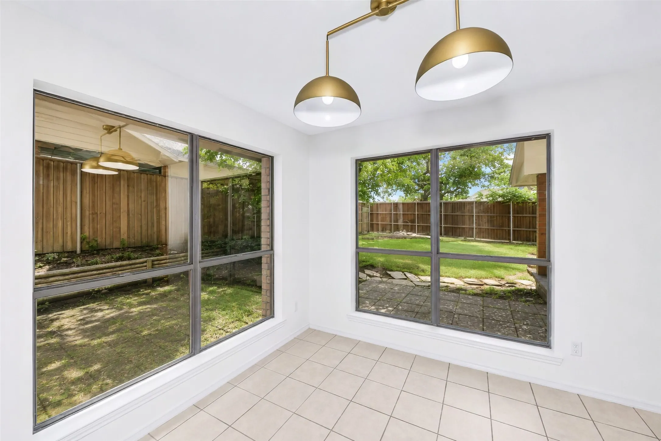 This breakfast area has a beautiful view of the backyard!