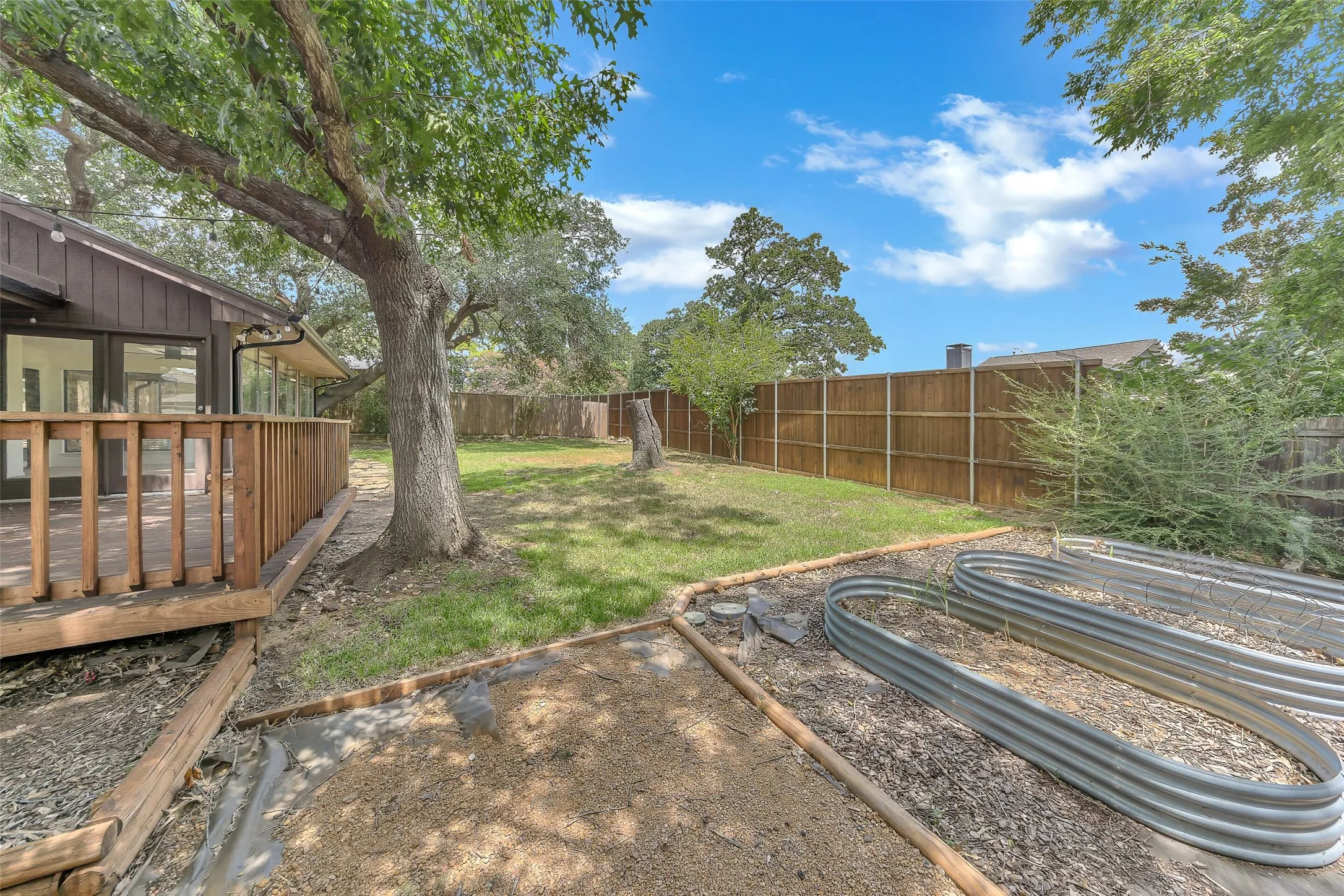 The backyard with a raised bed garden!