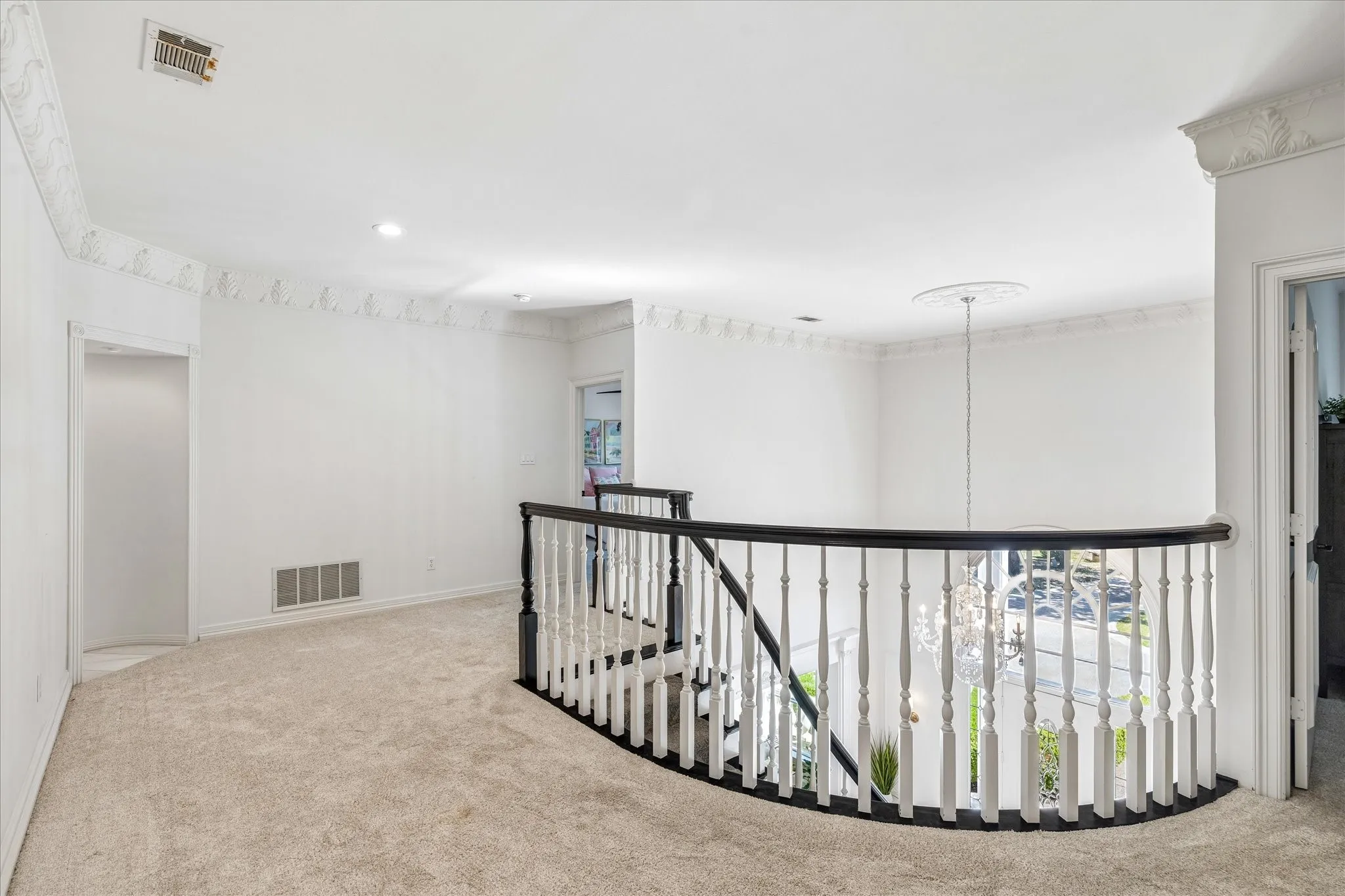 2nd story landing. Look at that space and beautiful crown moulding.