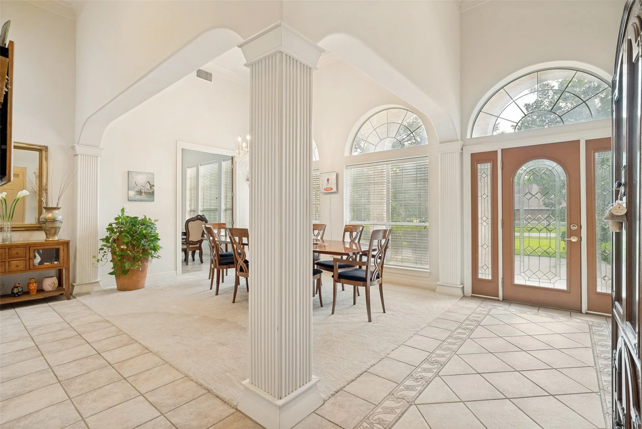 bright and open entry nest to formal dining room, textured columns