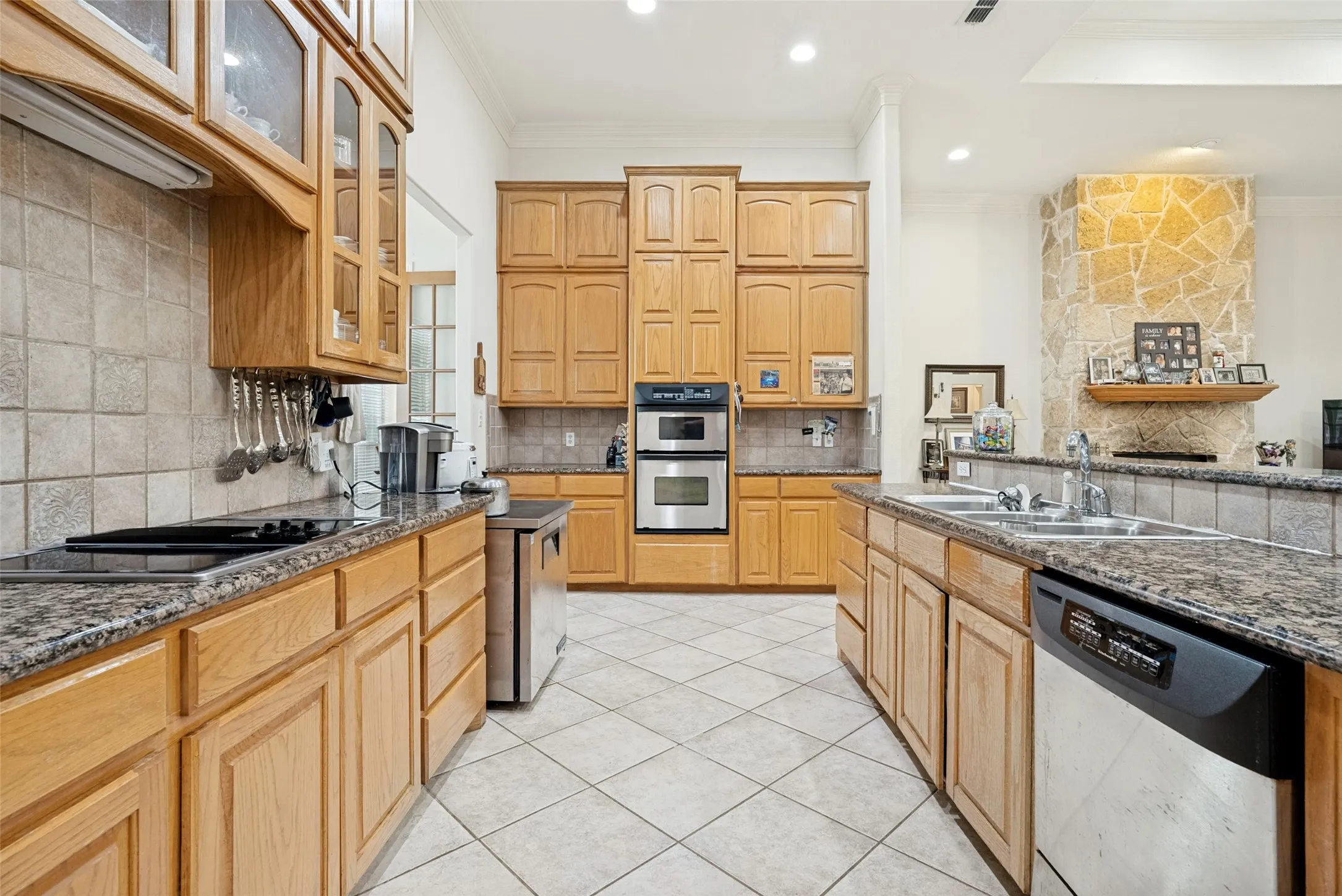 open kitchen with custom cabinetry,  walk-in pantry
