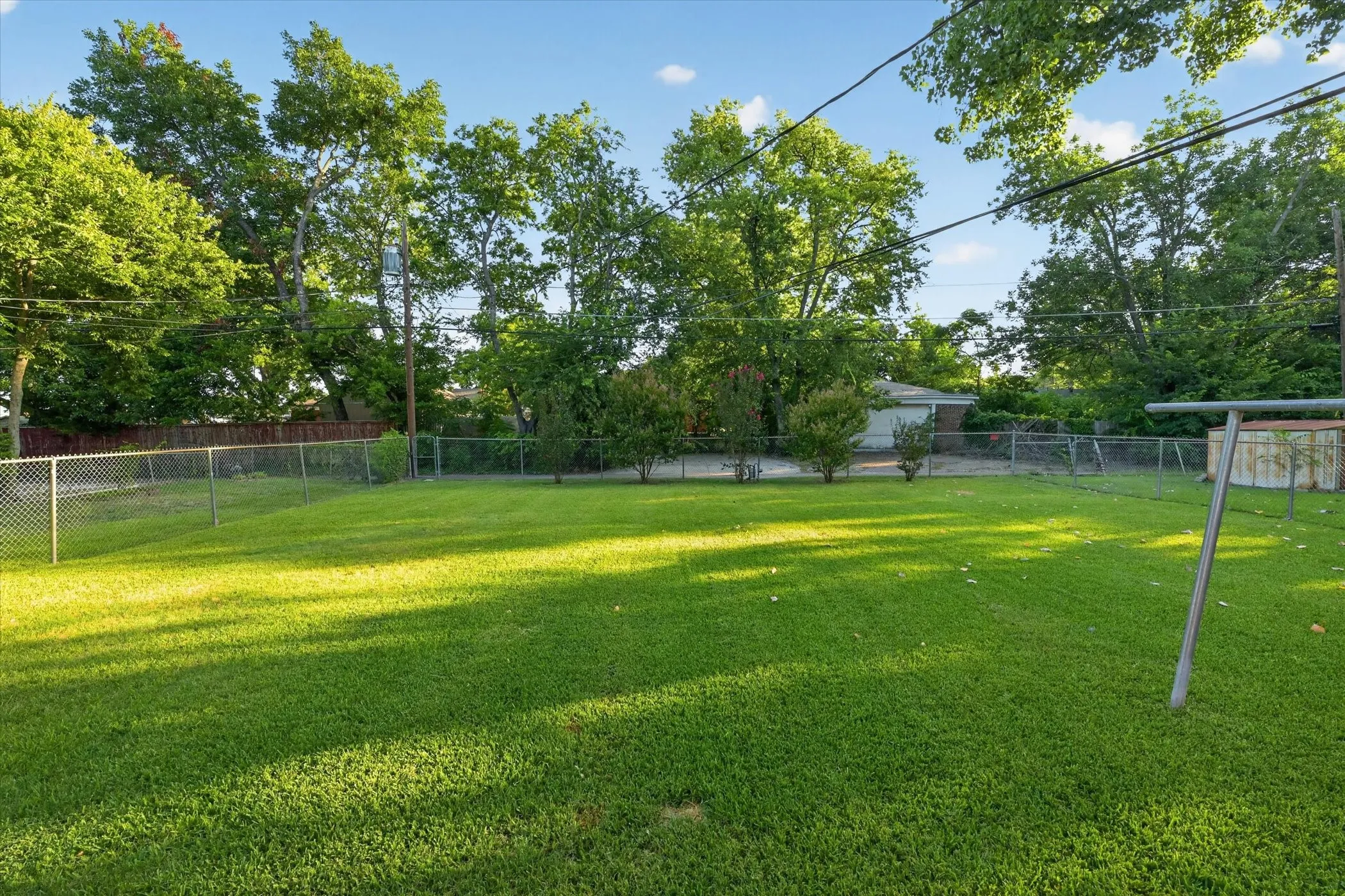 Expansive backyard with a large grassy lawn