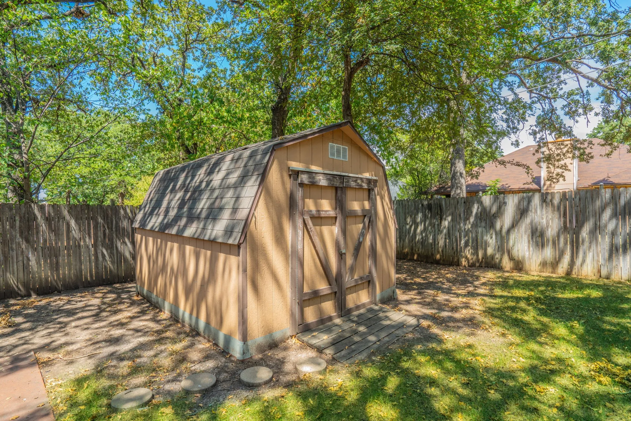 Storage shed is perfect for lawn equipment.