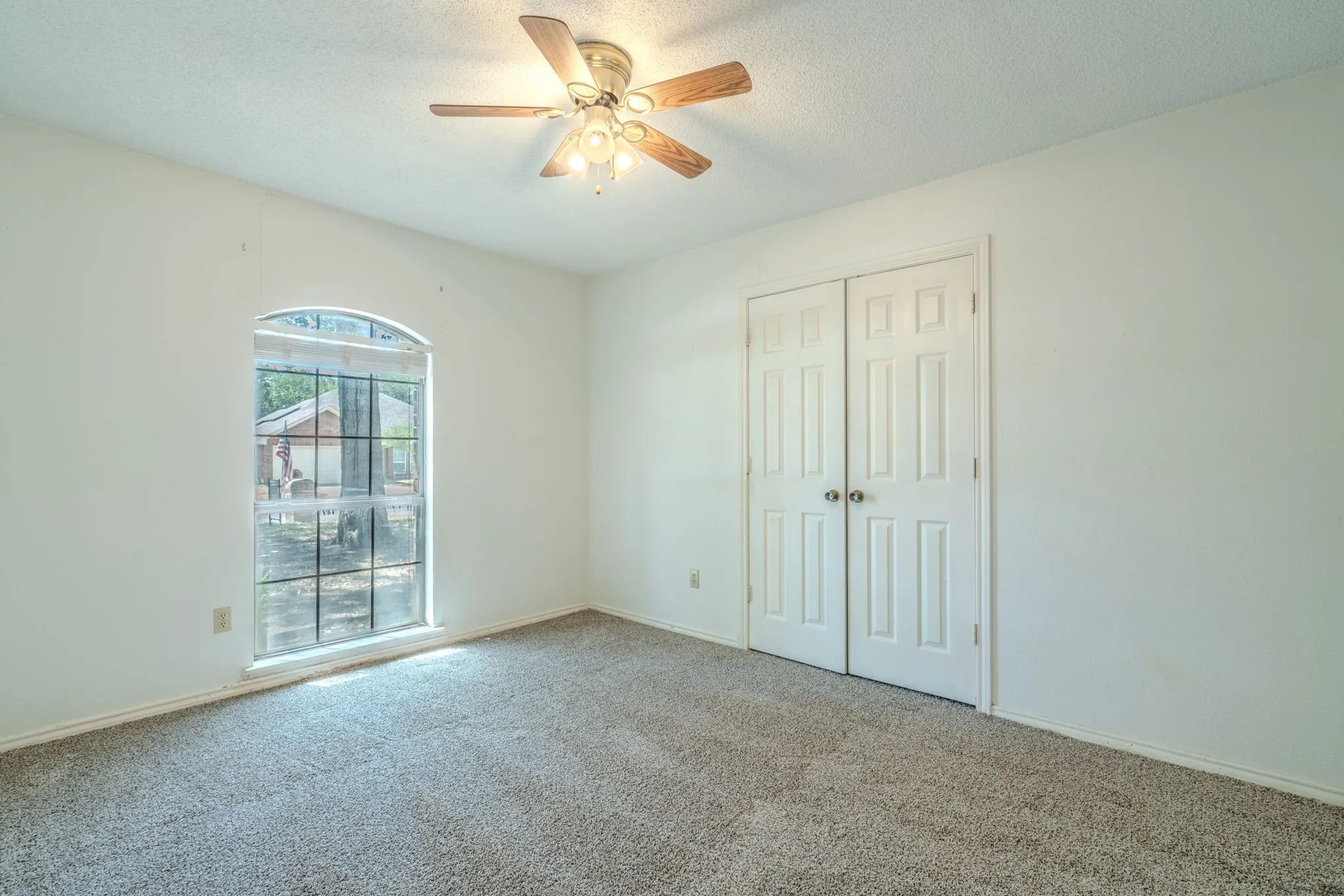 Secondary bedroom with walk-in closet and lots of natural light.