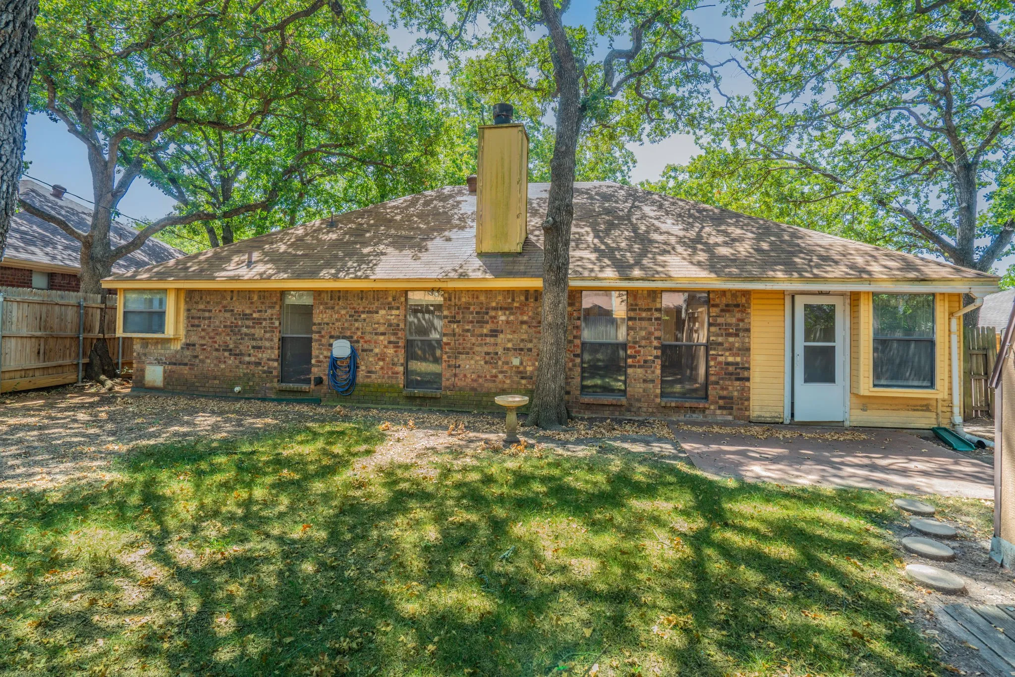 Spacious backyard with plenty of room for kids and family pets.