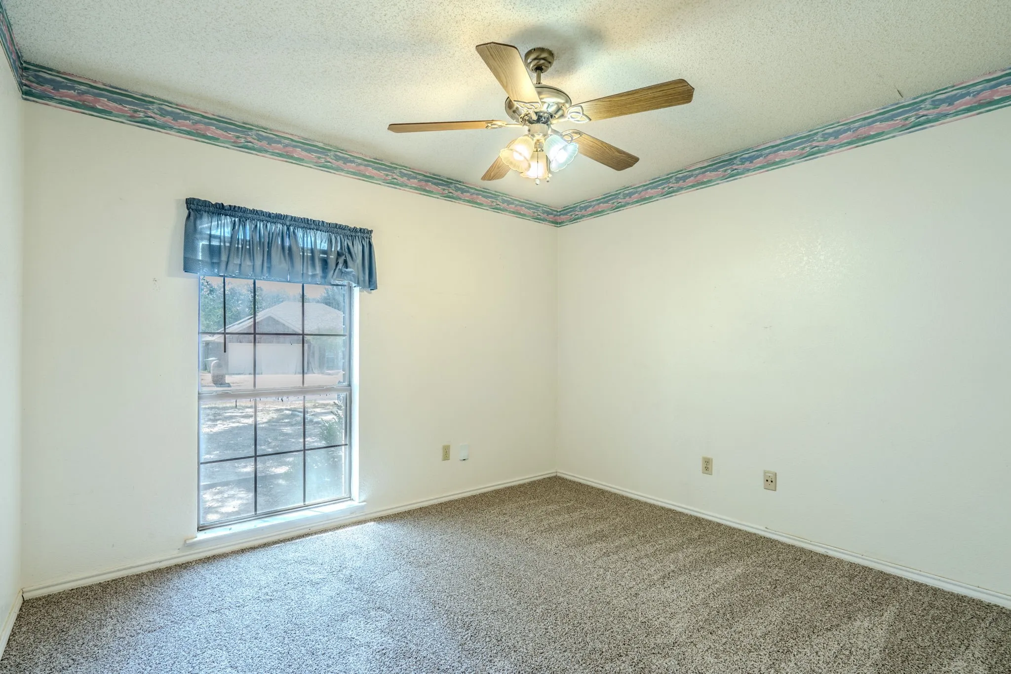 Secondary bedroom with NEW CARPET and lots of natural light.