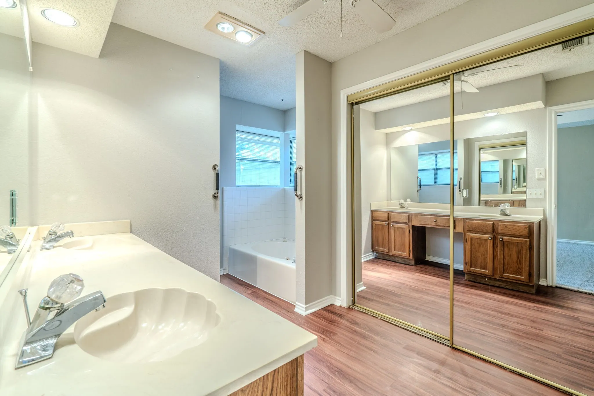 Primary bath feature a large sliding door closet.