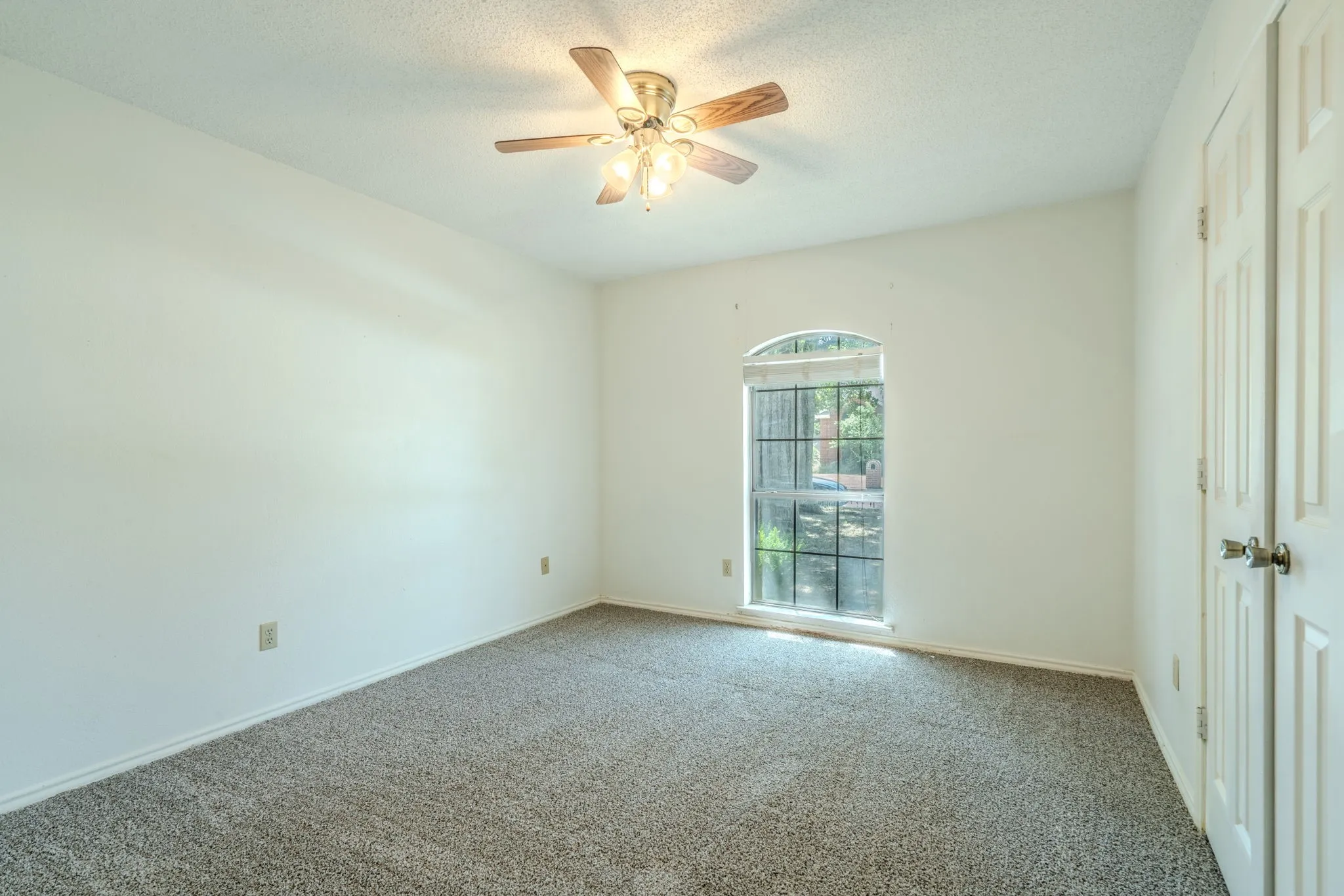 Secondary bedroom with NEW CARPET and neutral colors.