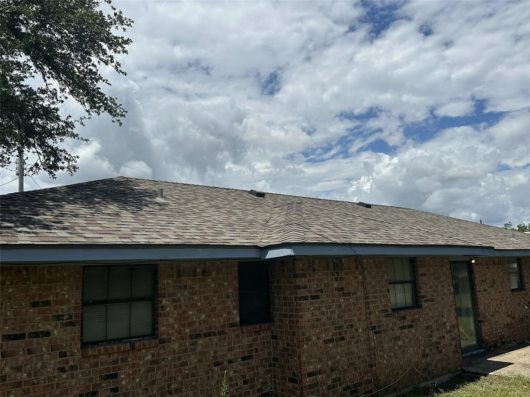 Roof view - Brown architectural shingle roof with a brick exterior
