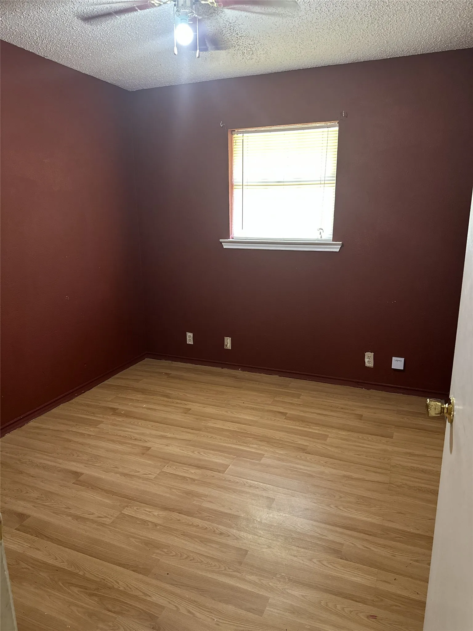 Bedroom 1 with blinds and ceiling fan with integrated lighting