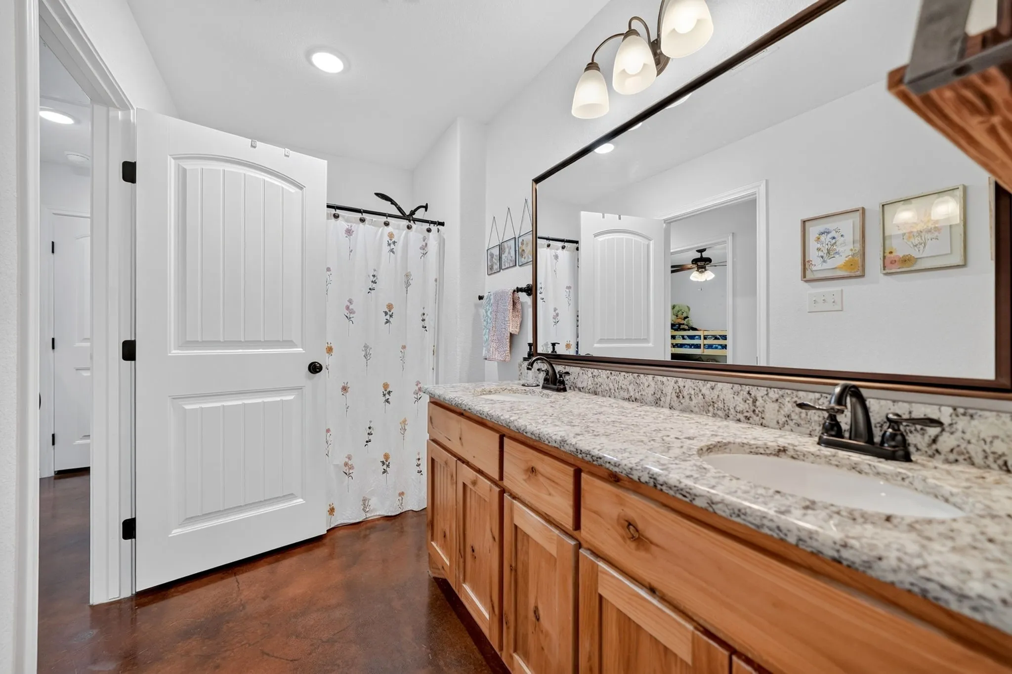 Double vanity with granite-style countertop and two undermount sinks