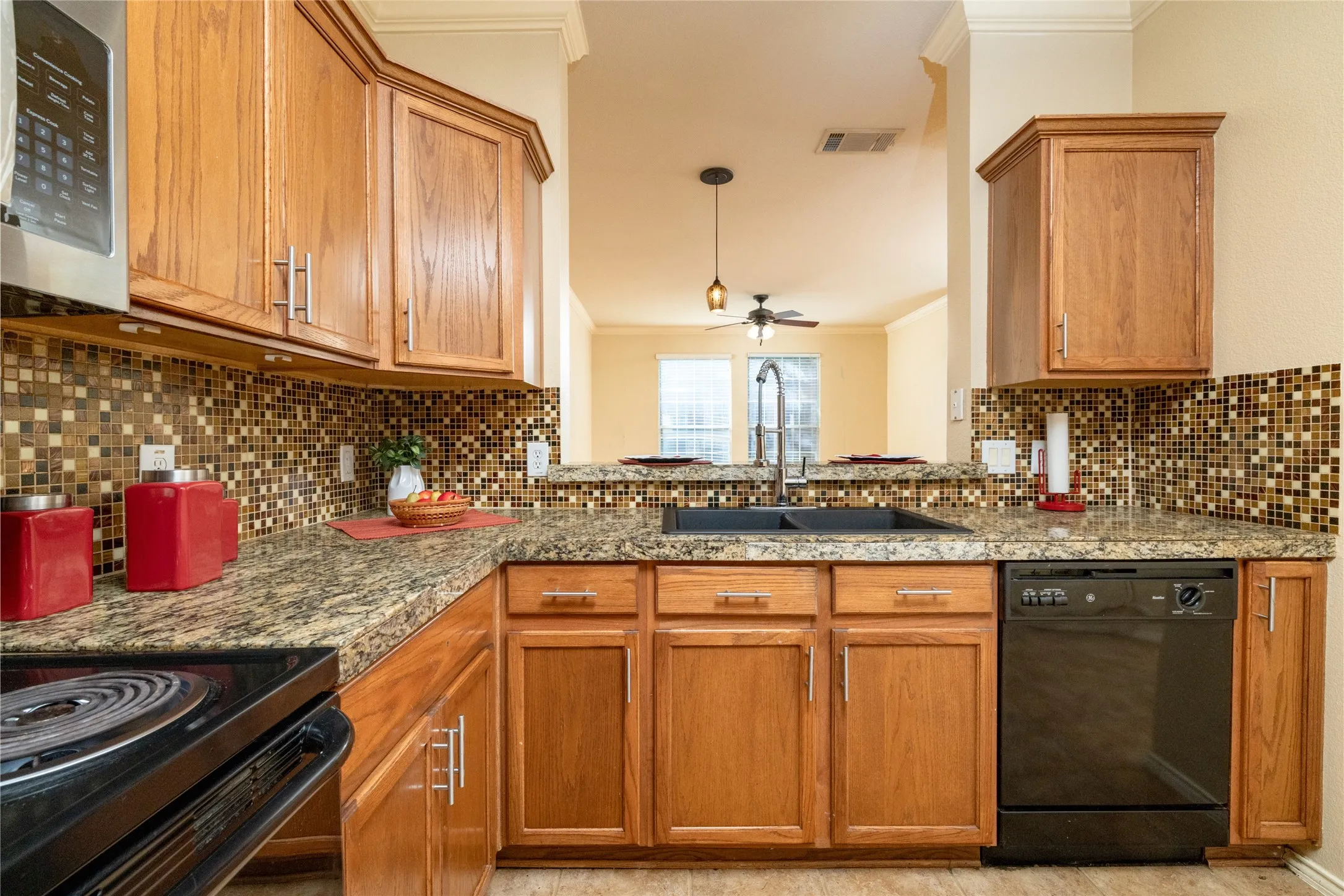 Notice the Tile BackSplash and Granite Tile Countertop ~ View to Dining & Living Area...
