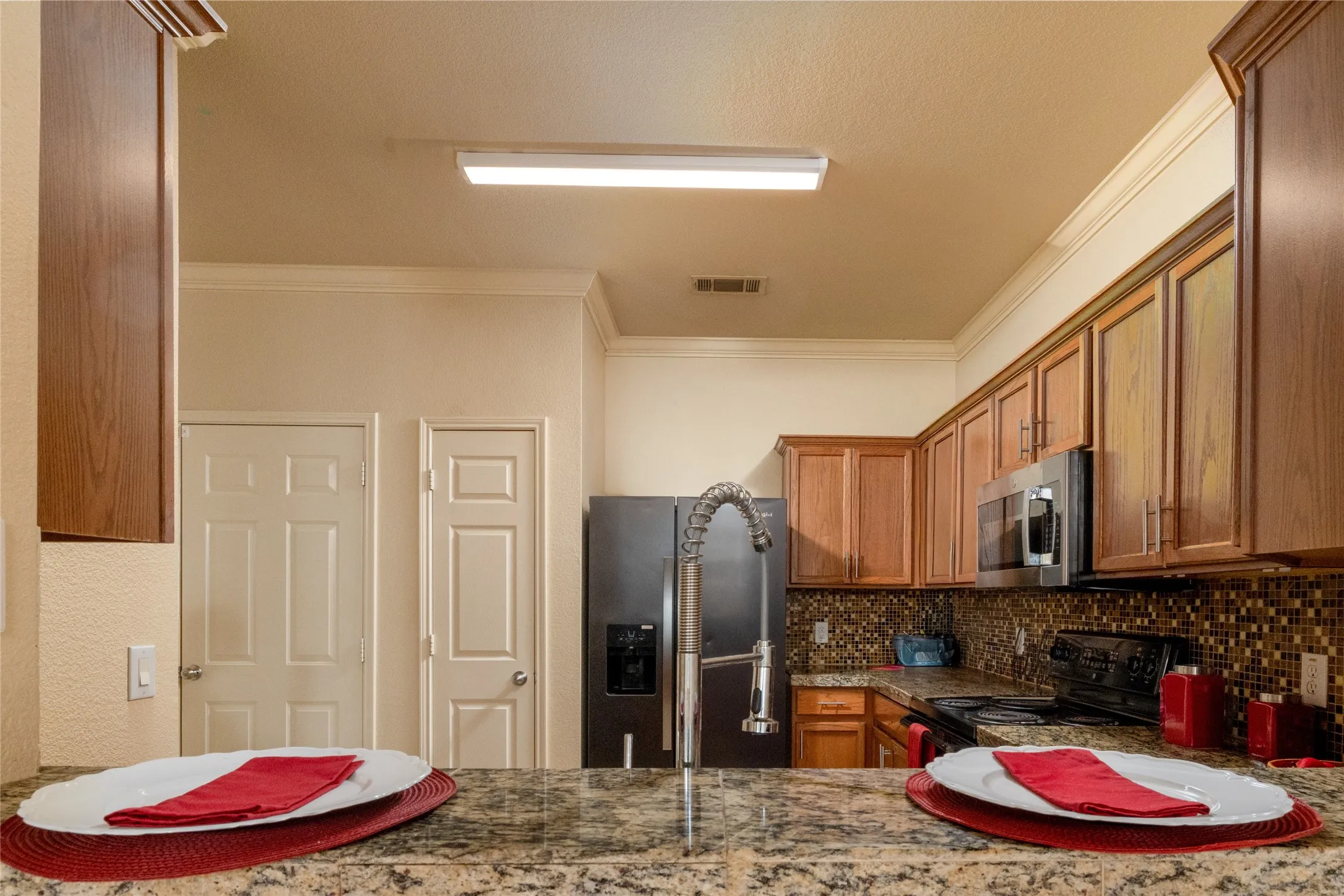 View to Kitchen from Breakfast Bar ~ Notice the Pantry...