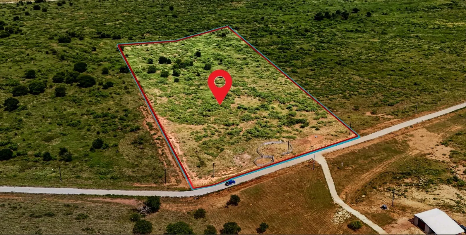 Expansive undeveloped land parcel featuring a visible boundary line