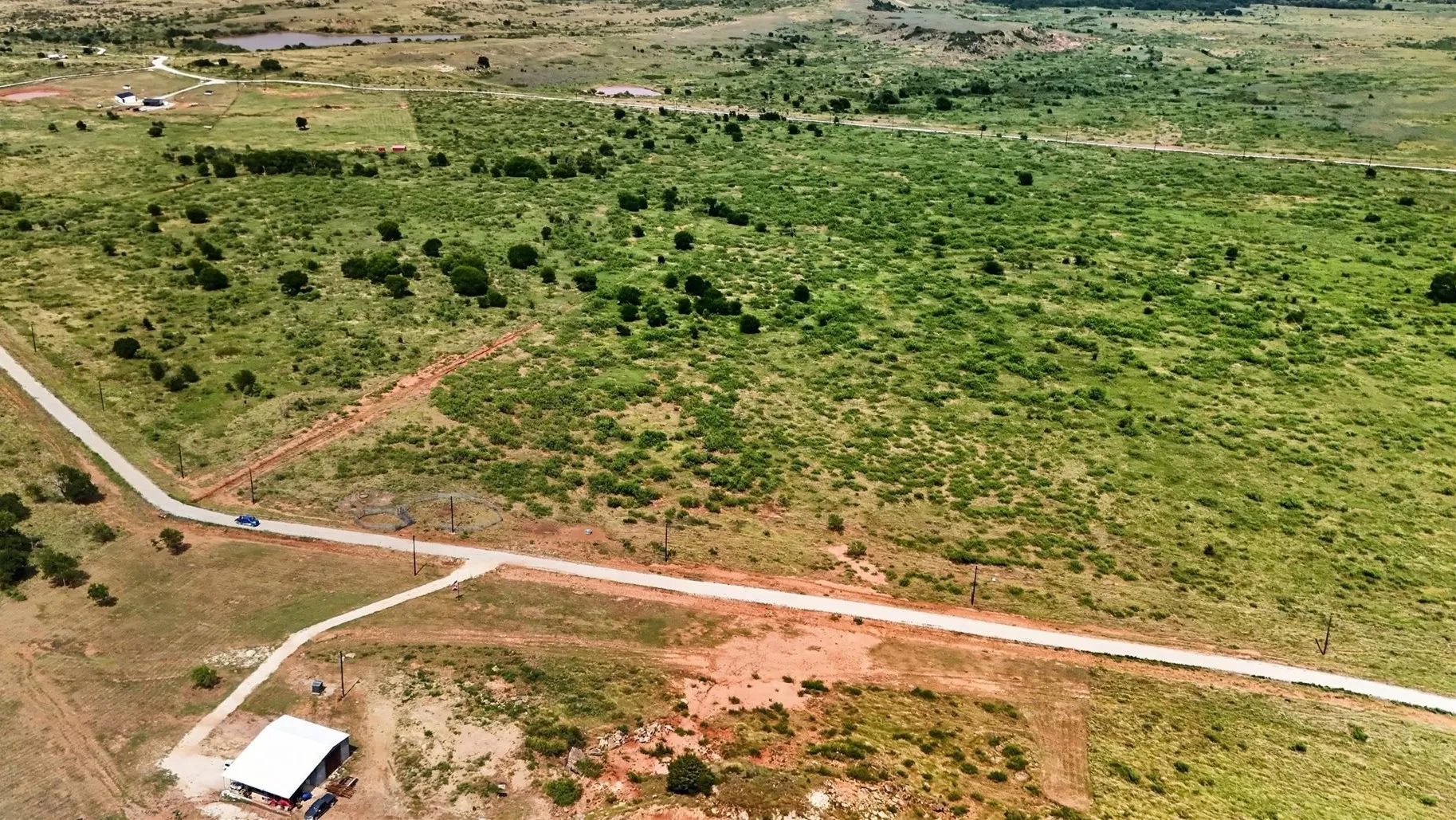 Expansive natural landscape featuring a mixture of green foliage and open terrain