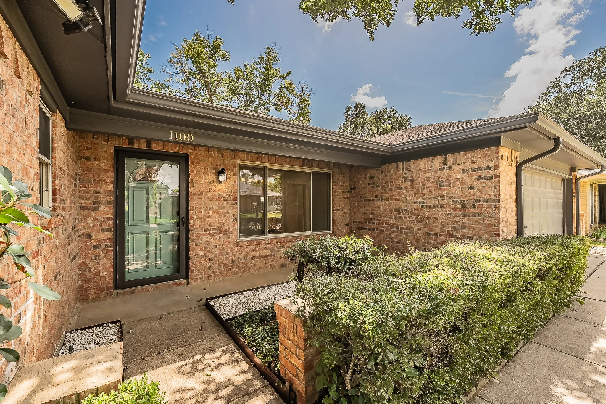 Spacious entry with a clear storm door that provides an unobstructed view of the outdoors.