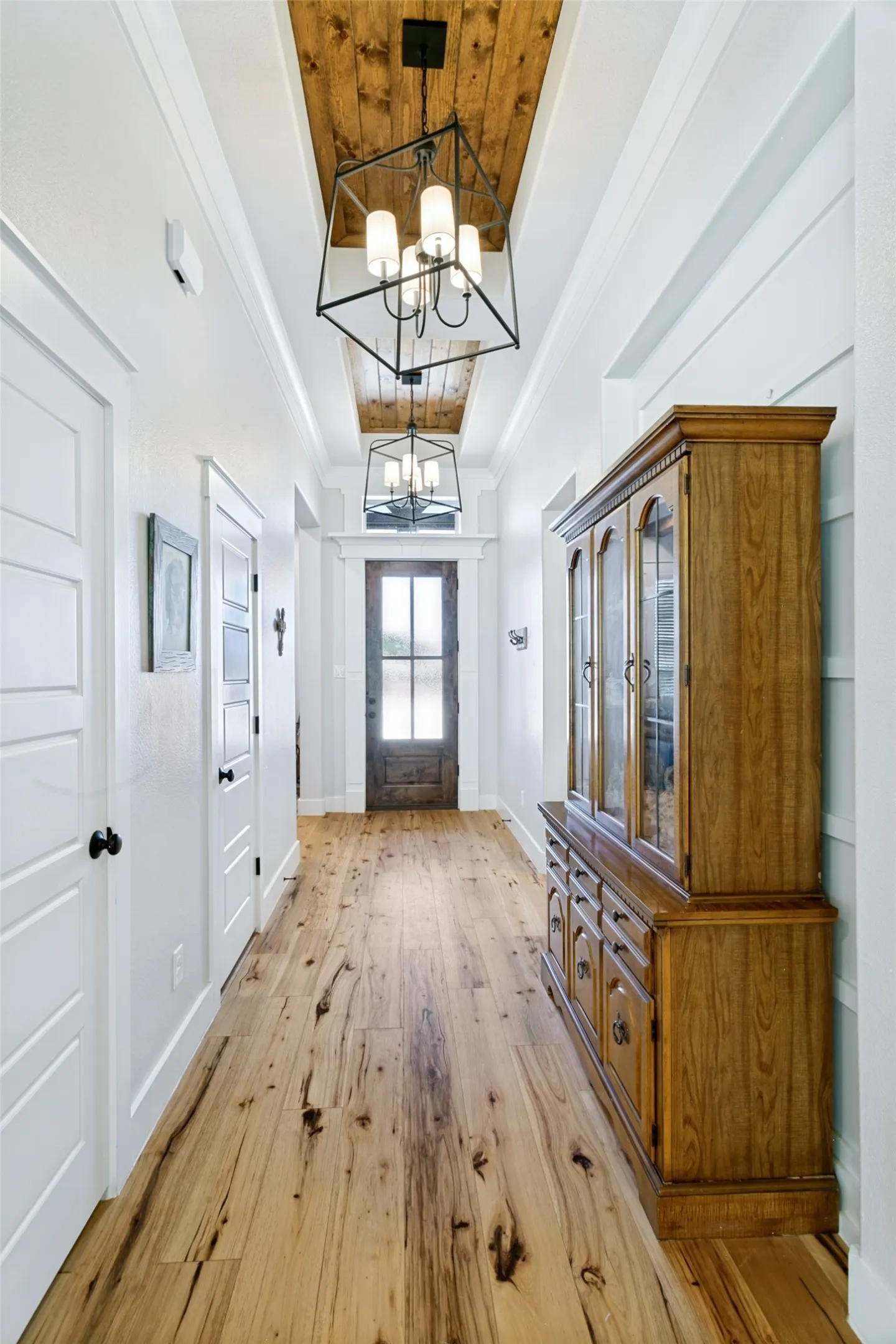 Stunning wood floors and a wood ceiling feature piece