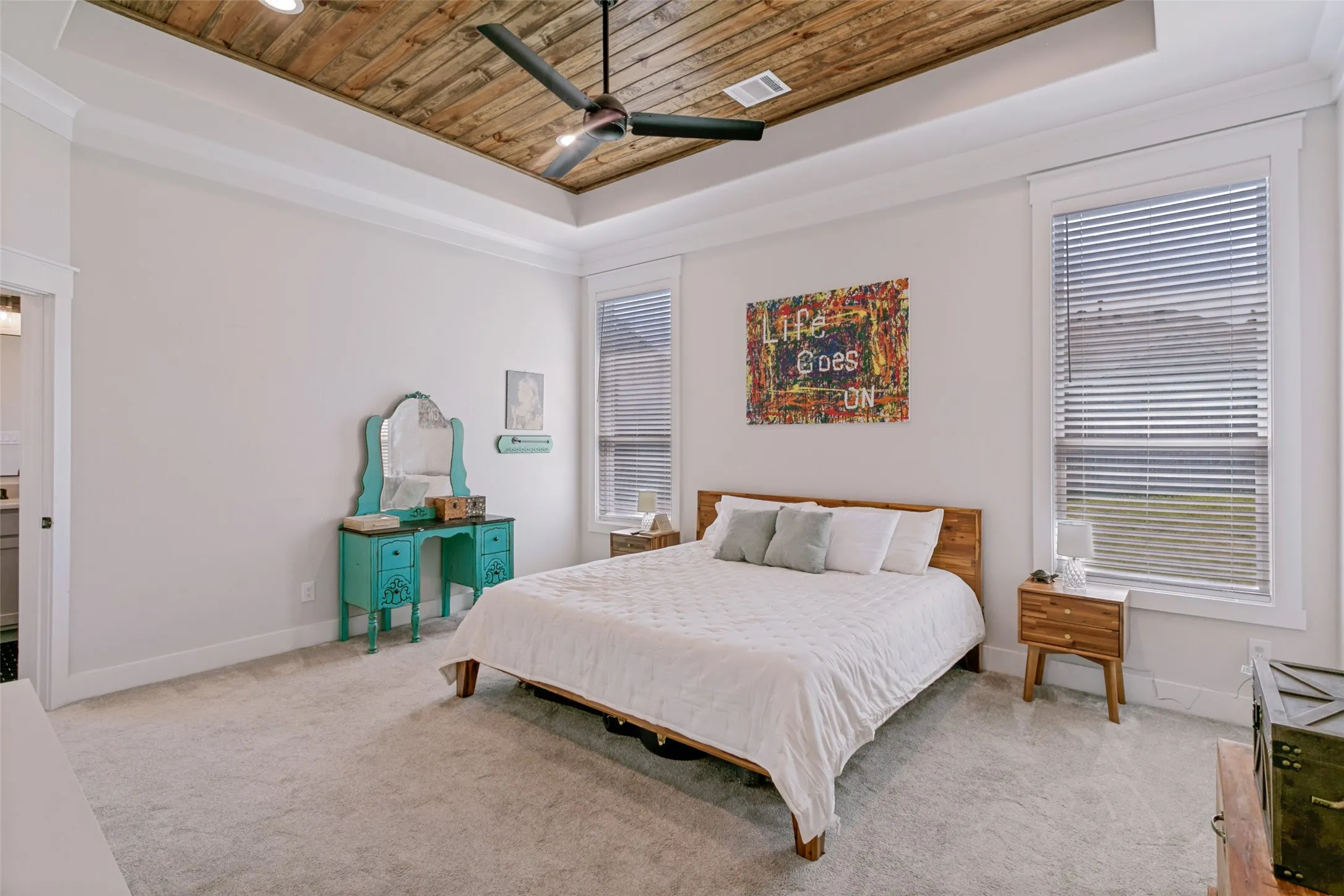 Primary bedroom with a wood ceiling