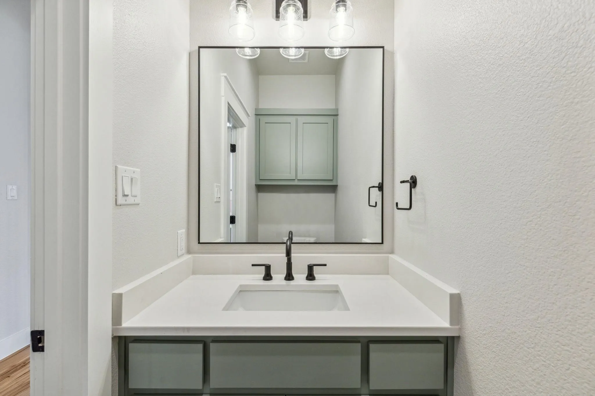 Half bathroom off the entry