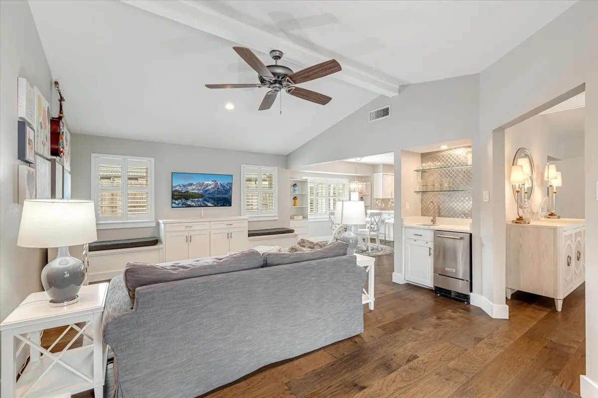 Living area featuring elegant wet bar.
