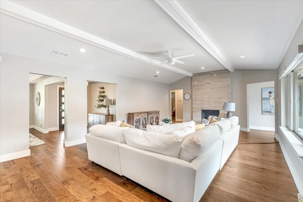 Living area with wood burning fireplace.