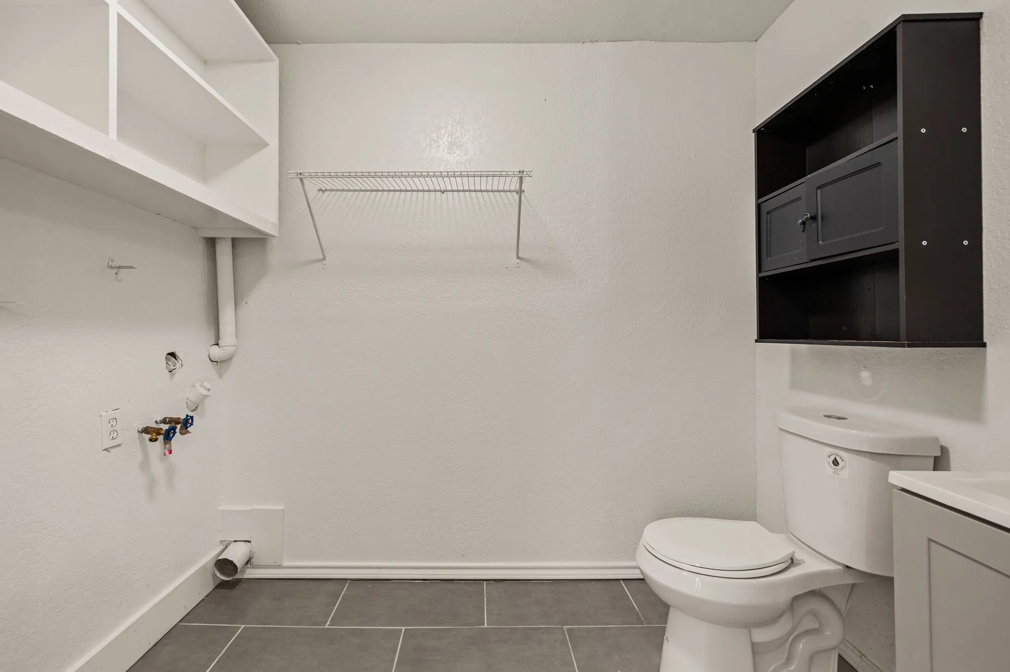 Utility room with half bath