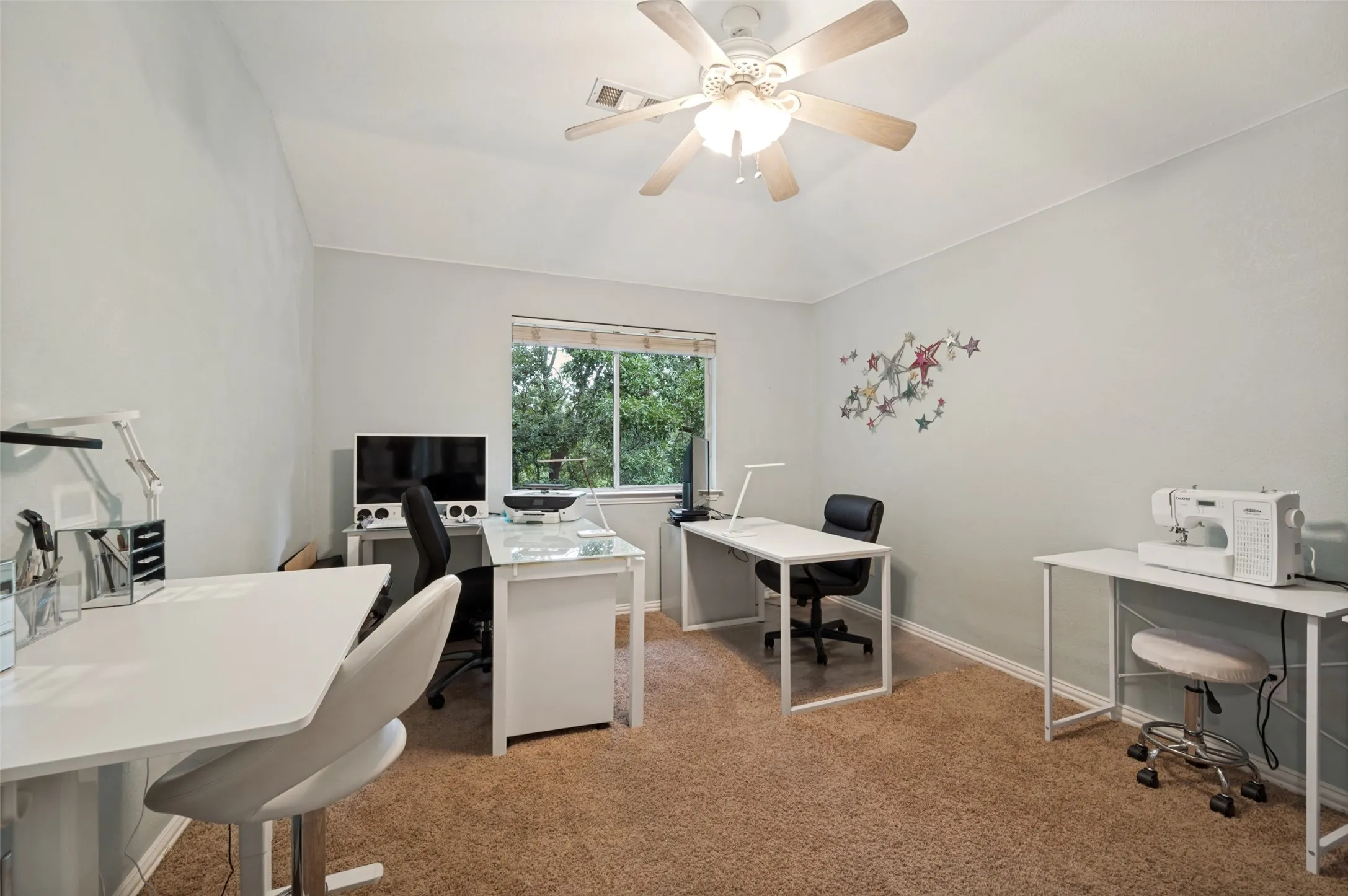 This secondary oversized bedroom is currently being used as an office. Plenty of private, quiet space for at home workers or crafts.