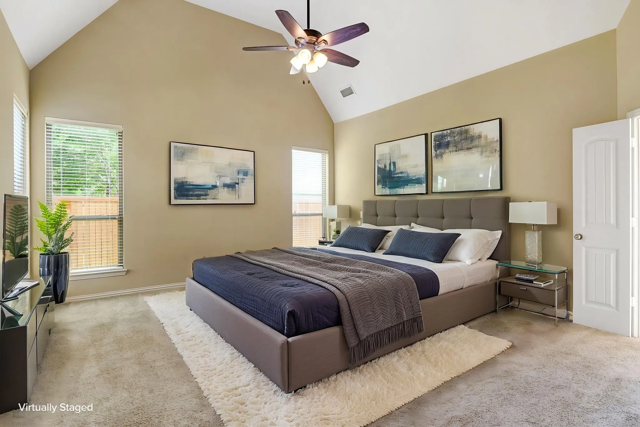 Vaulted ceiling featuring a ceiling fan with integrated lighting