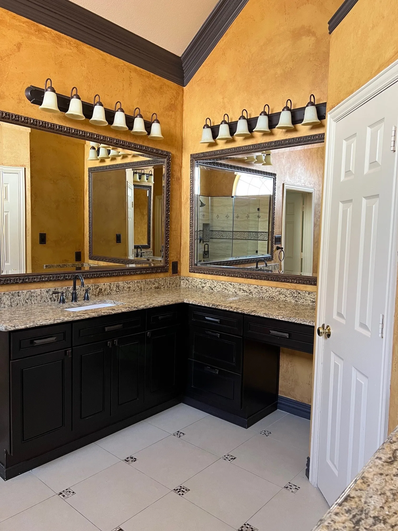 Bathroom featuring ornamental molding, vanity, and tile patterned floors