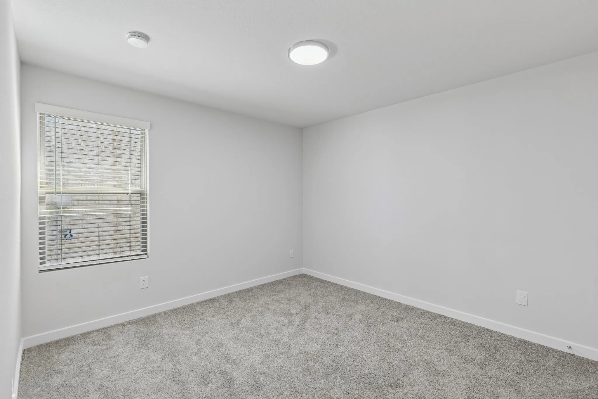 Bedroom in the Harrison home plan by Trophy Signature Homes – REPRESENTATIVE PHOTO