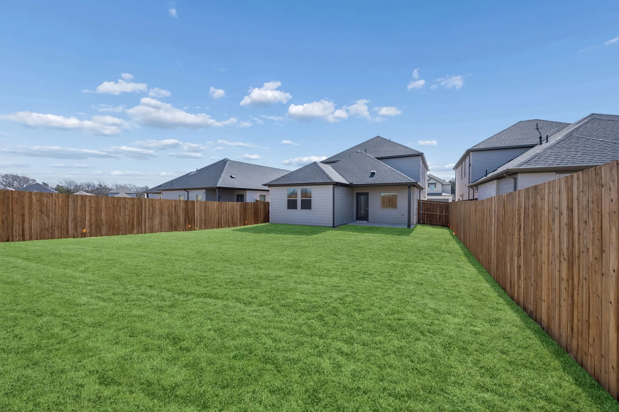 Covered Patio in the Oak II home plan by Trophy Signature Homes – REPRESENTATIVE PHOTO