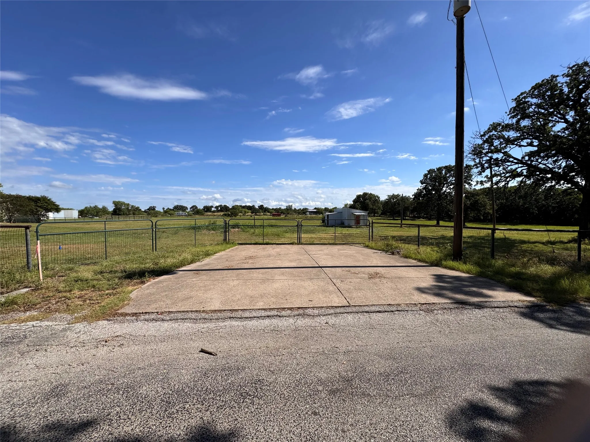 Front concrete approach and metal gates