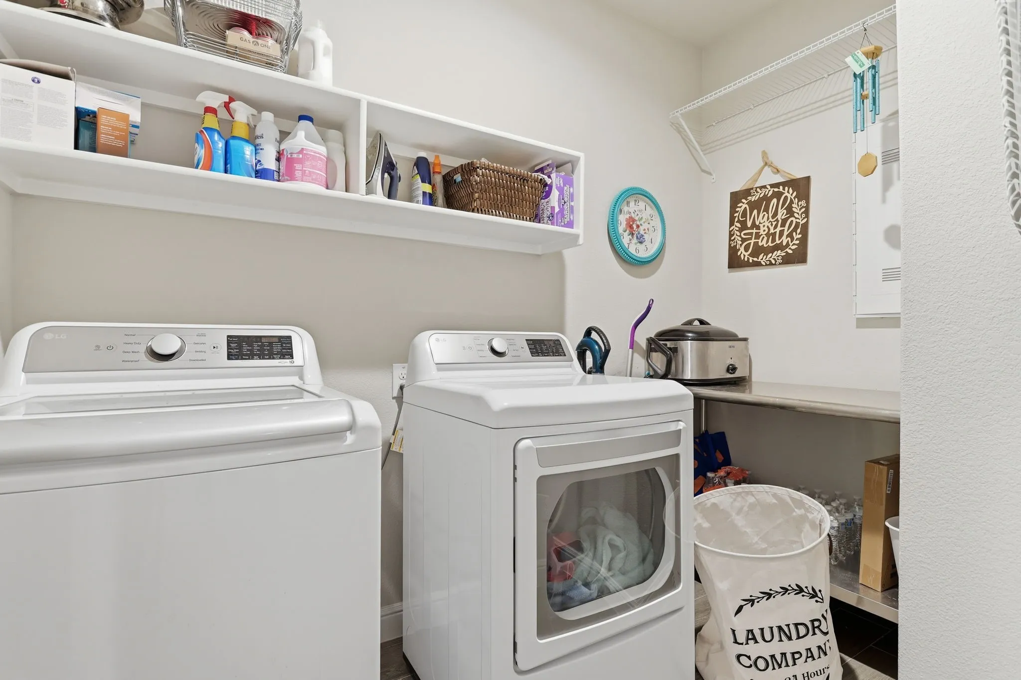 Shelving and a drying rod in laundry room.