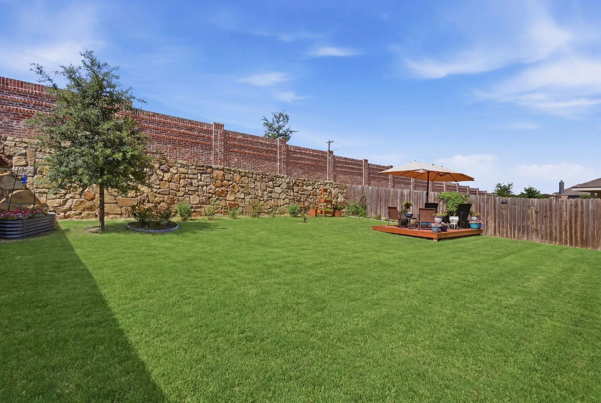 Privacy fence and lots of landscaping.