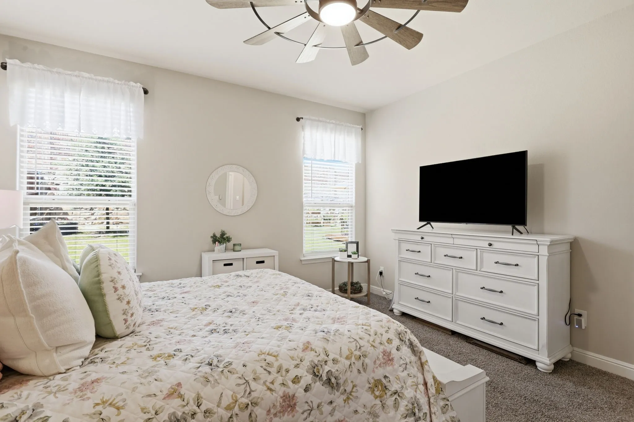 Primary bedroom looks out onto lovely backyard.