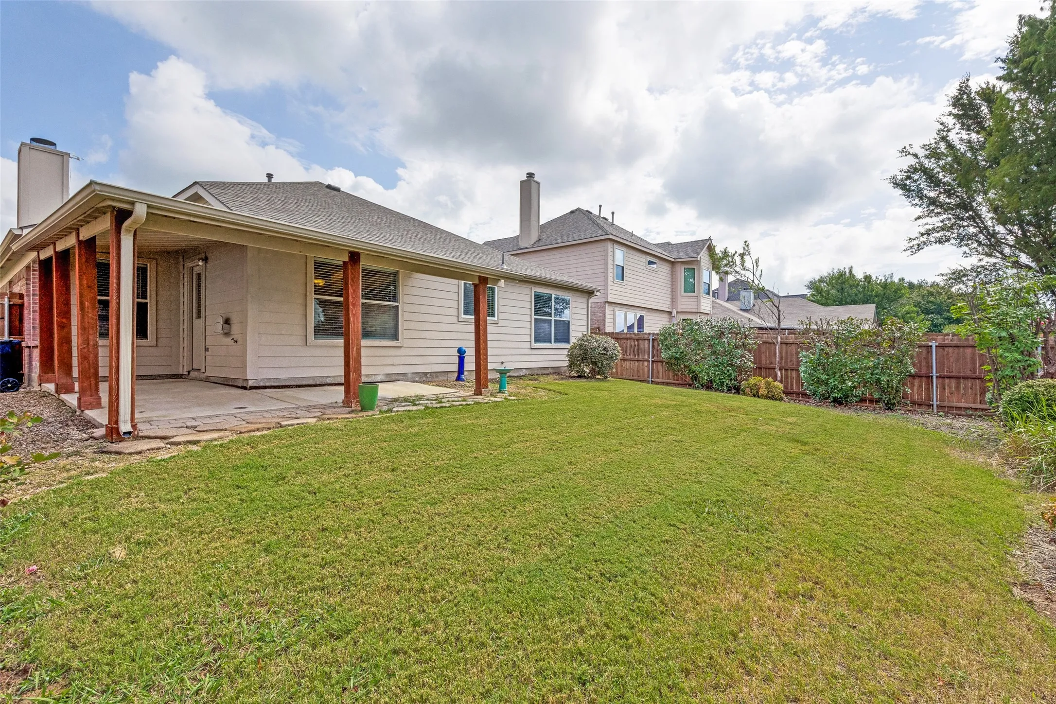 Fenced yard with landscaping