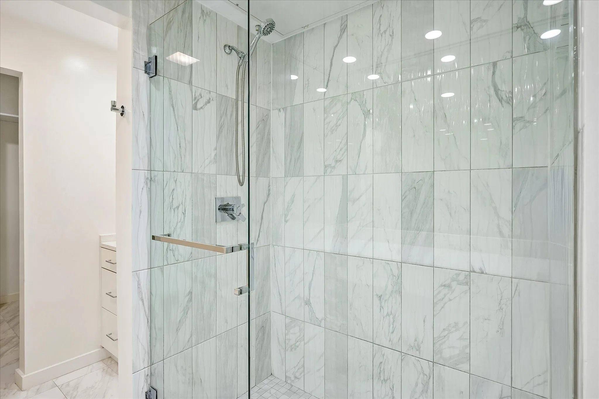 Elegant oversized shower in primary bathroom.