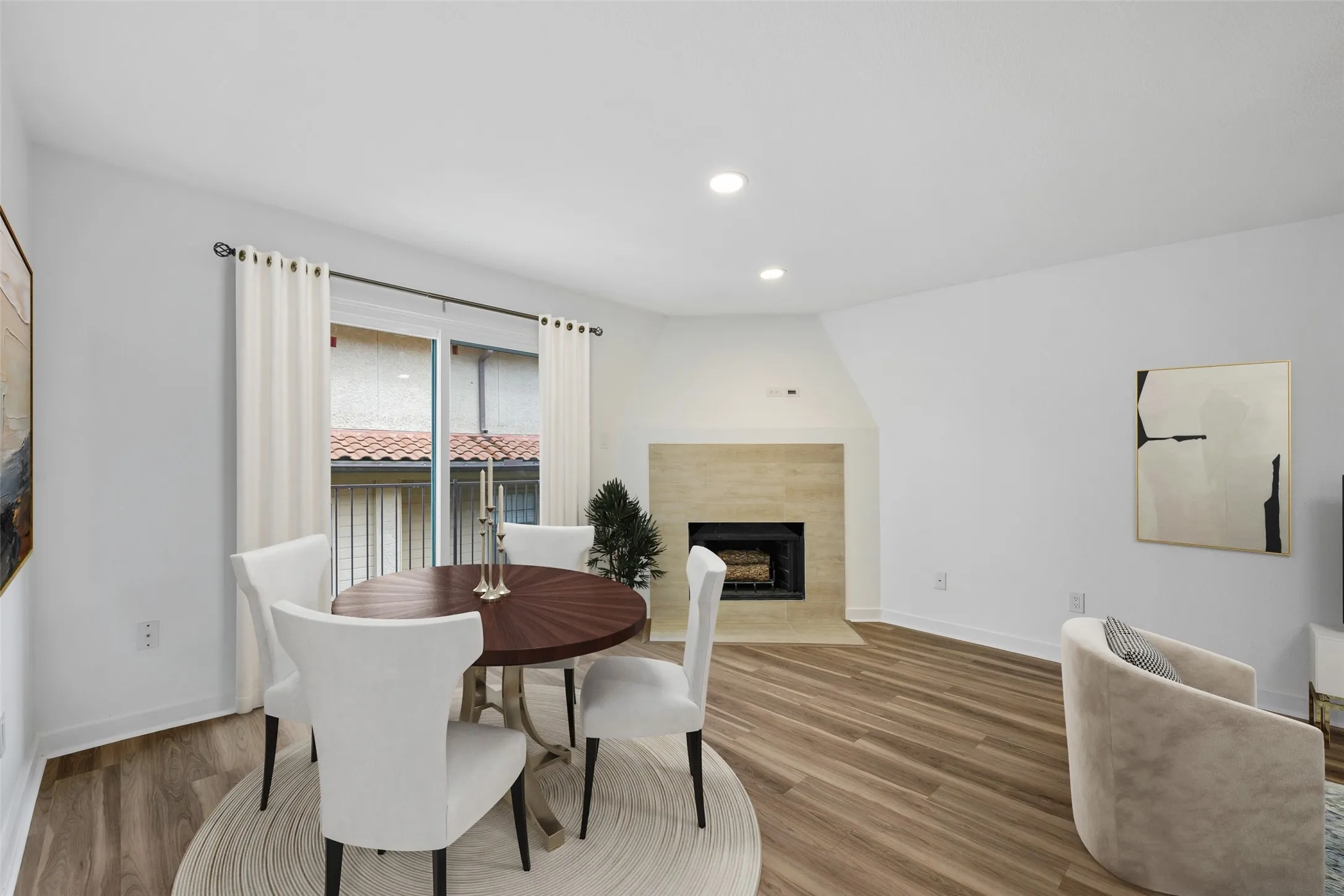 Dining area with balcony access (virtually staged)