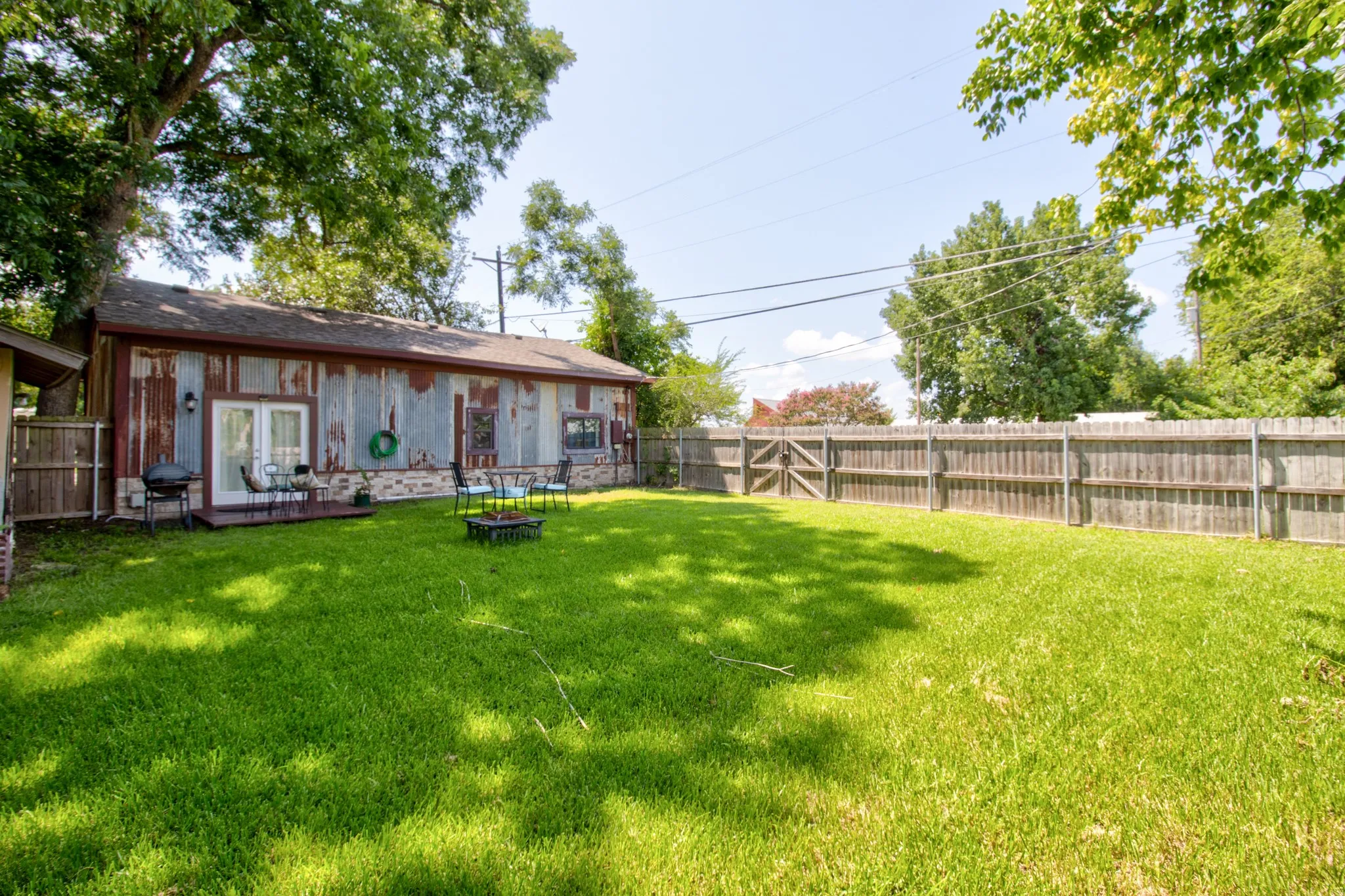 Back yard with wood privacy fencing.