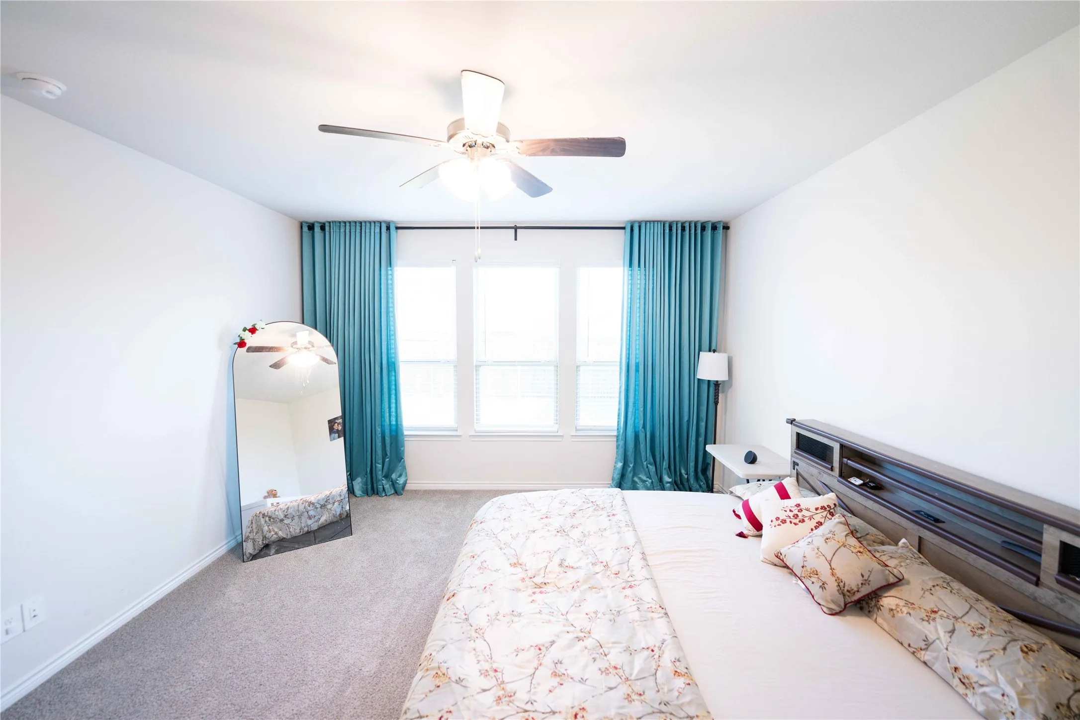 Room featuring light gray carpeting and white walls