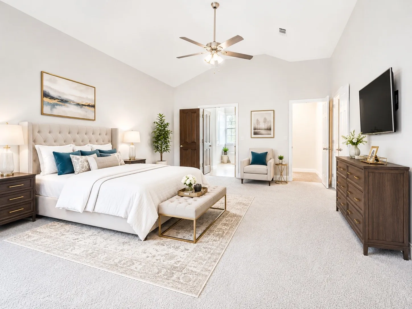 Bedroom ceilings enhance this generously sized room featuring neutral carpeting and a ceiling fan