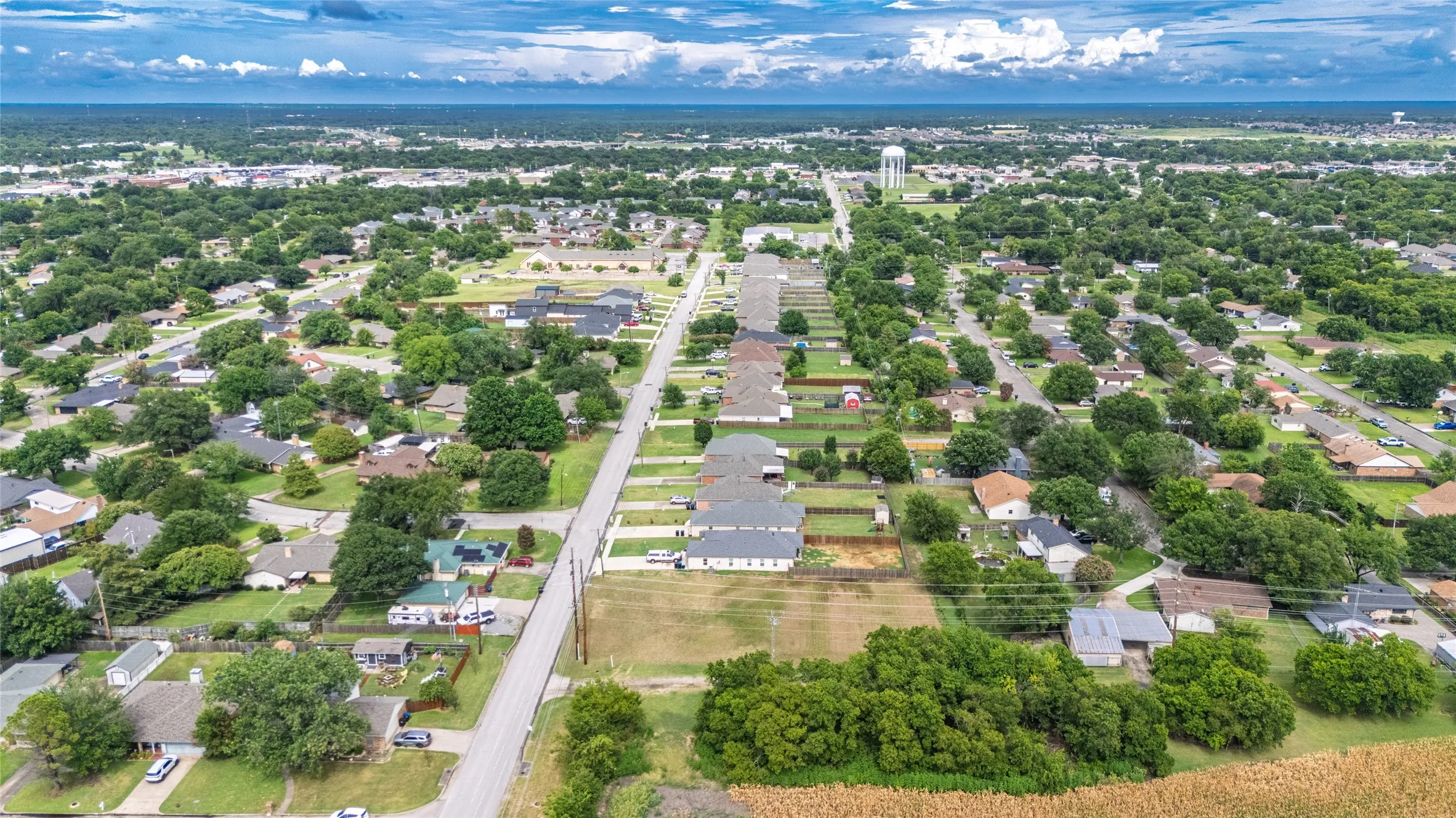 Aerial perspective showcasing a residential area with established tree cover and multiple streets