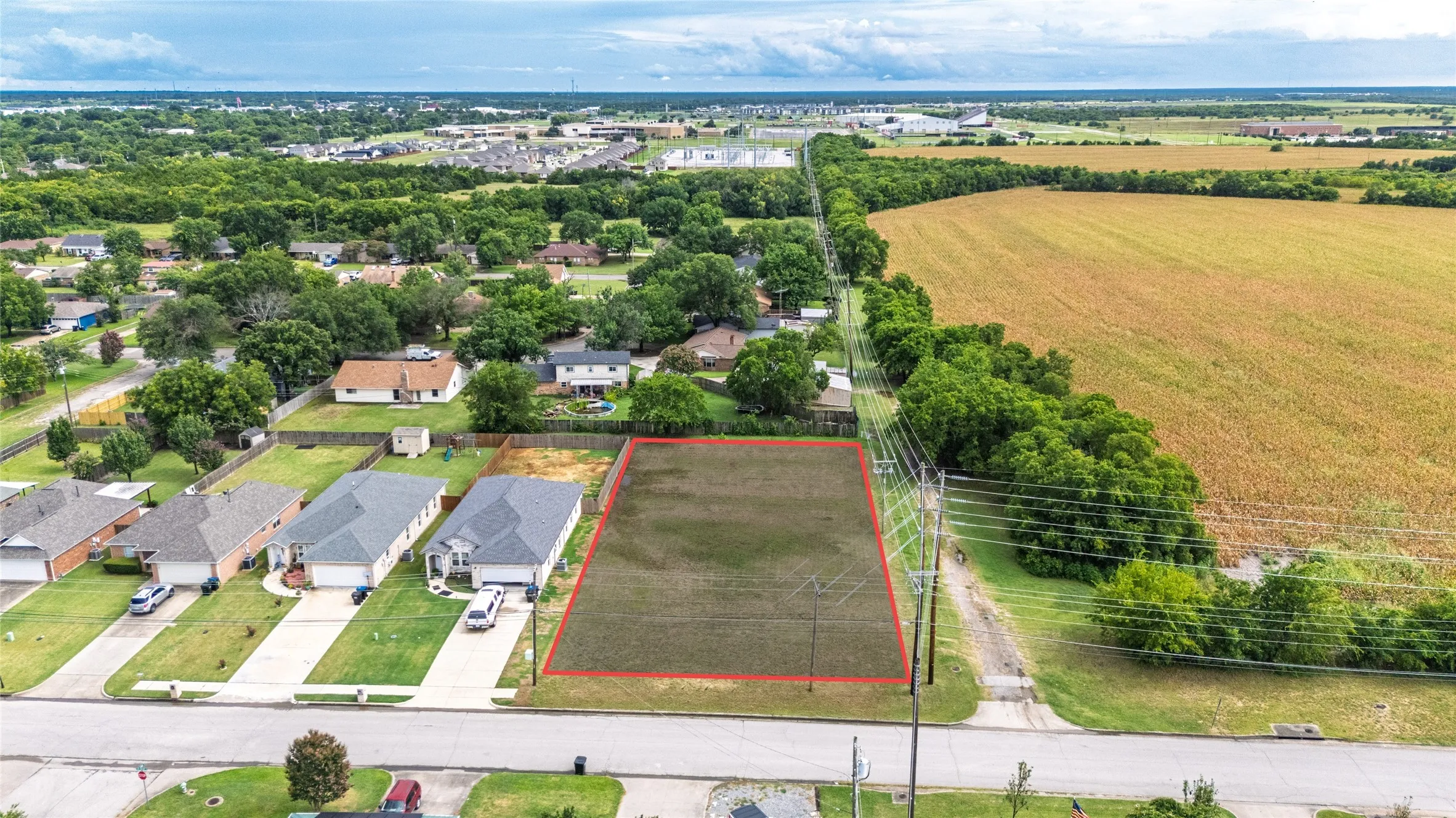 Cleared residential lot featuring a flat terrain, ready for development