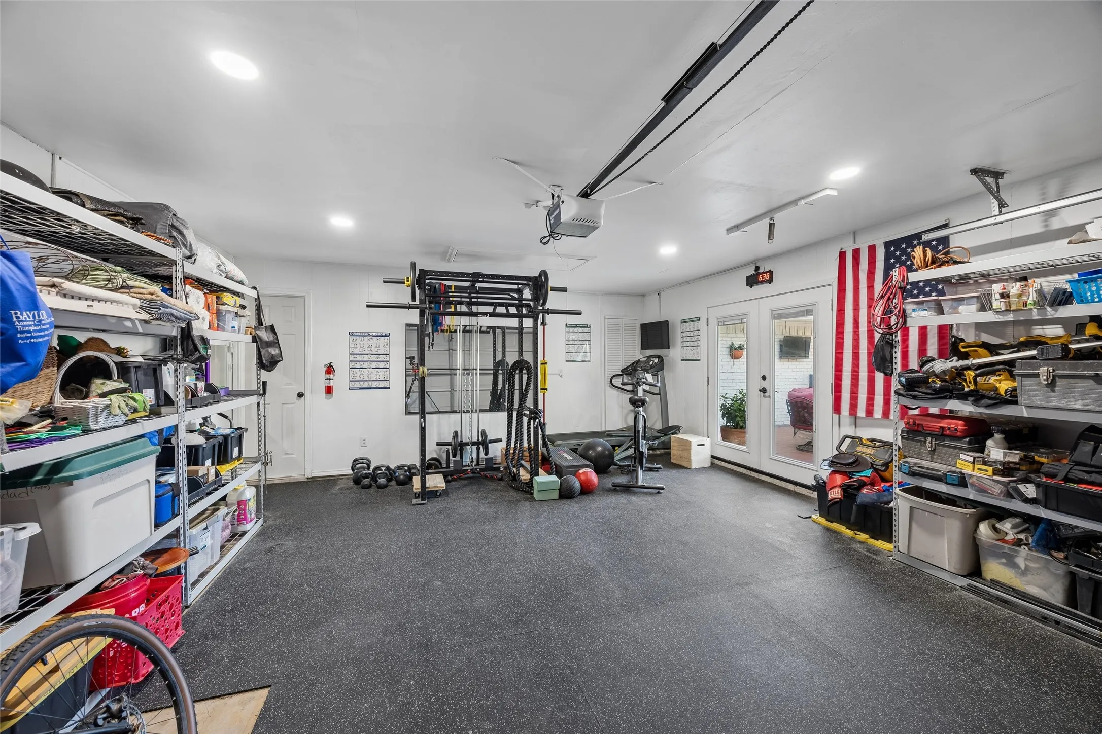 Garage being used as gym with tons of storage