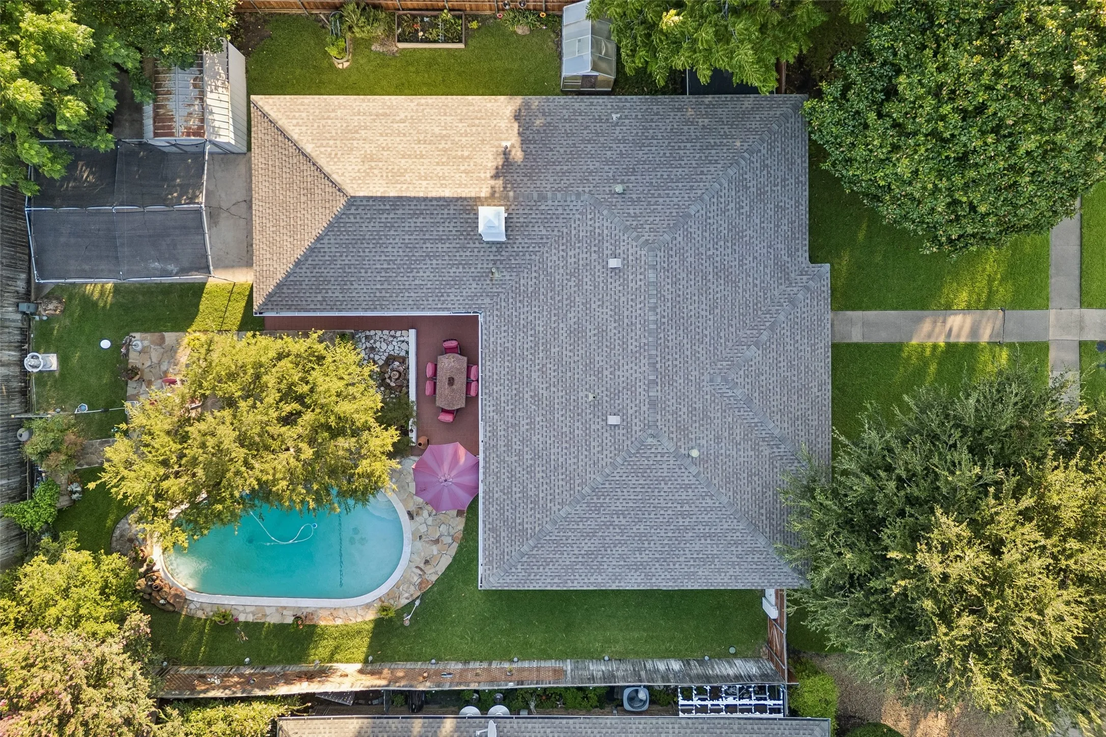 Aerial perspective highlighting the property's exterior and expansive backyard