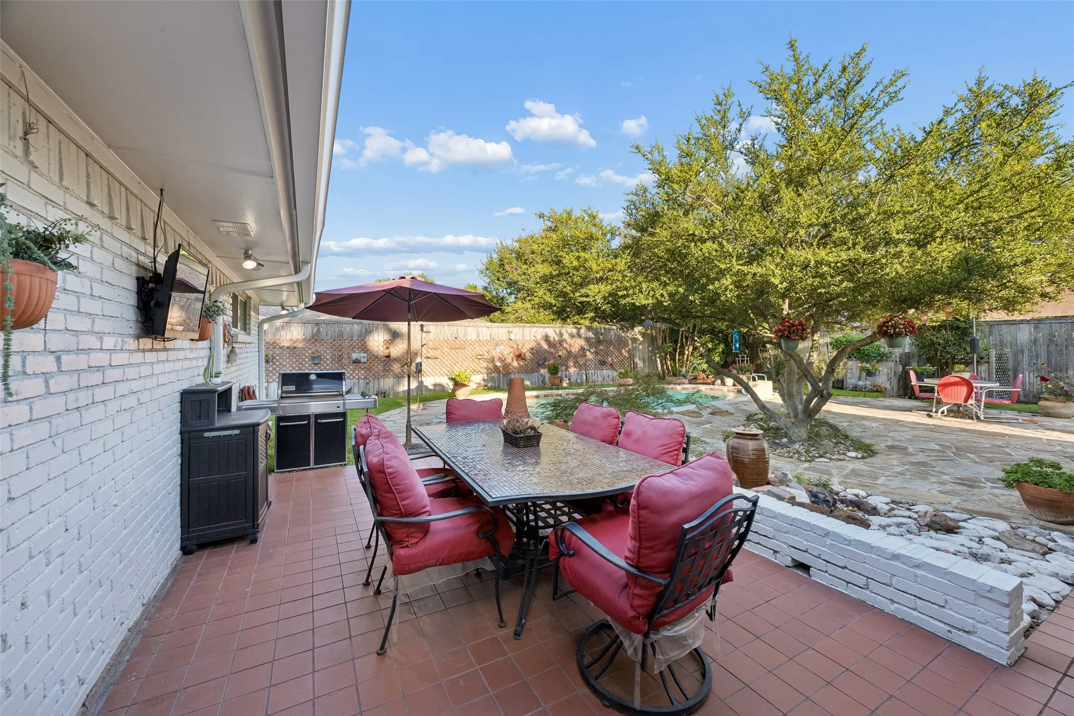 Covered patio featuring terracotta tile flooring